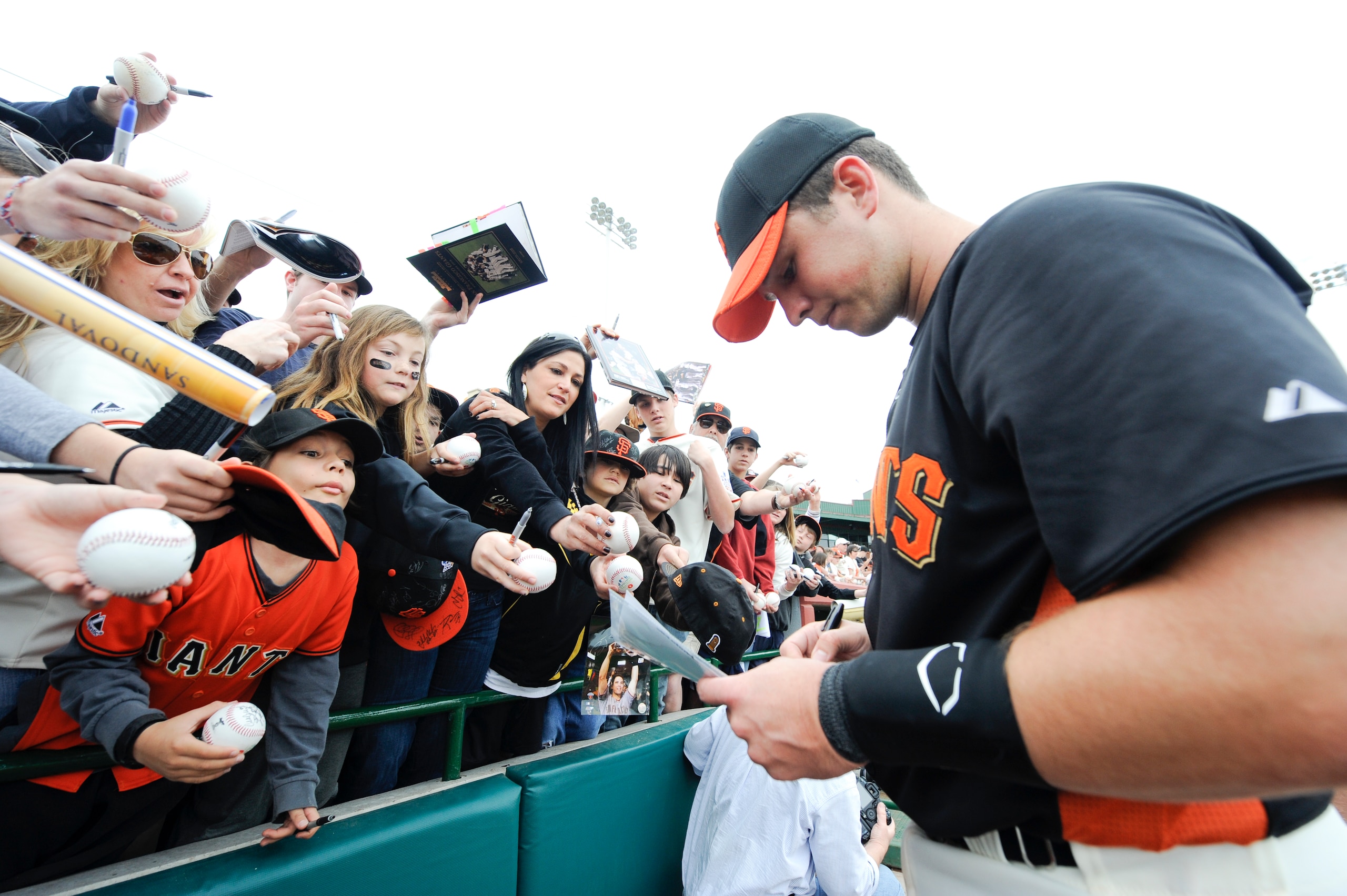 SCOTTSDALE, AZ - FEBRUARY 26: Buster Posey #28 of the San Francisco Giants signs autographs before a spring training game against the Los Angeles Dodgers at Scottsdale Stadium on February 26, 2011 in Scottsdale, Arizona. (Photo by Rob Tringali/Getty Image
