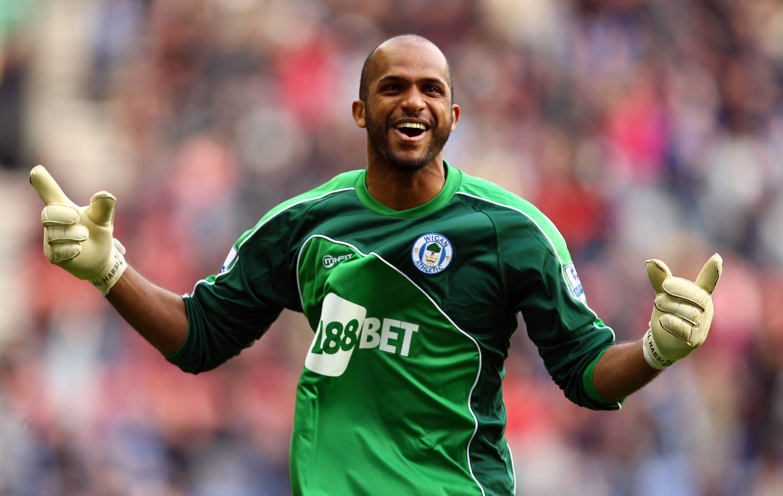 WIGAN, ENGLAND - MARCH 19:  Wigan goal keeper Ali Al Habsi celebrates the winning goal during the Barclays Premier League match between Wigan Athletic and Birmingham City at the DW Stadium on March 19, 2011 in Wigan, England.  (Photo by Richard Heathcote/