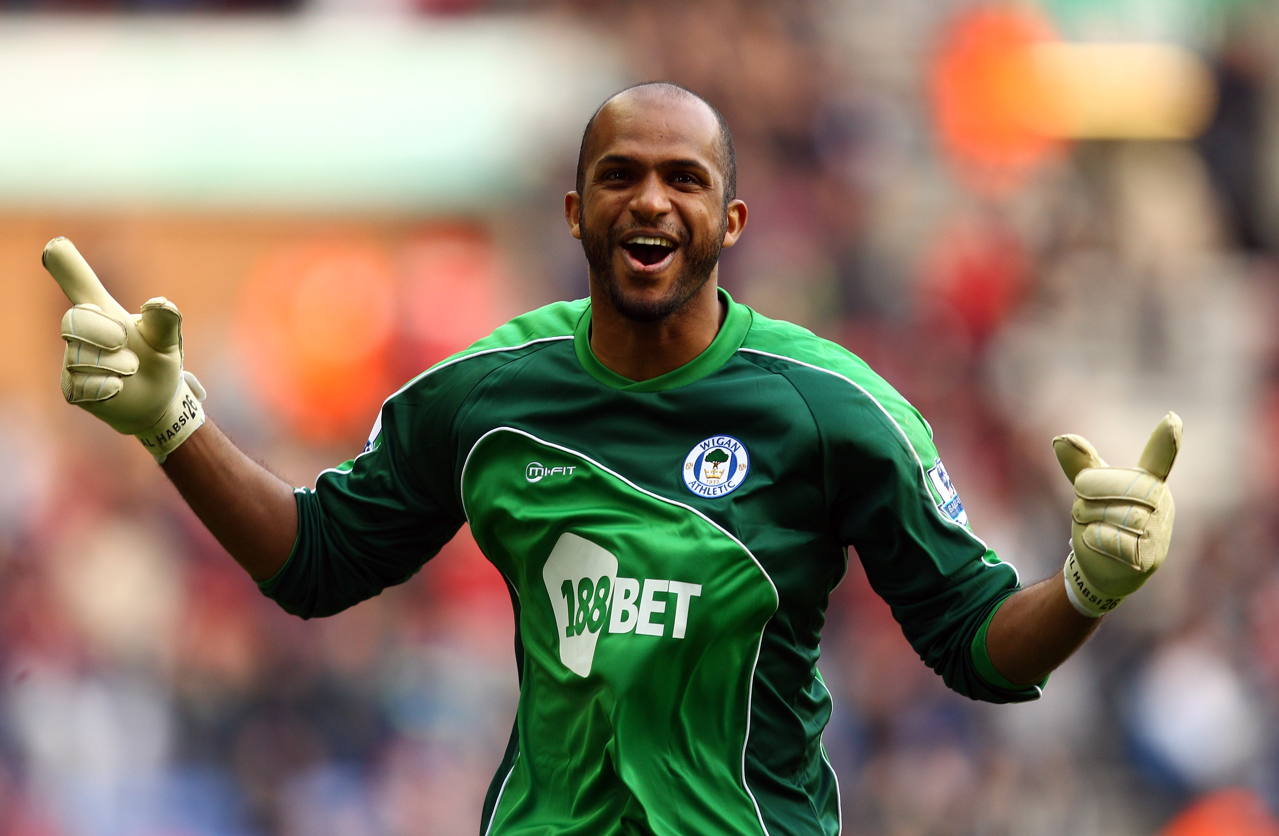 WIGAN, ENGLAND - MARCH 19:  Wigan goal keeper Ali Al Habsi celebrates the winning goal during the Barclays Premier League match between Wigan Athletic and Birmingham City at the DW Stadium on March 19, 2011 in Wigan, England.  (Photo by Richard Heathcote/