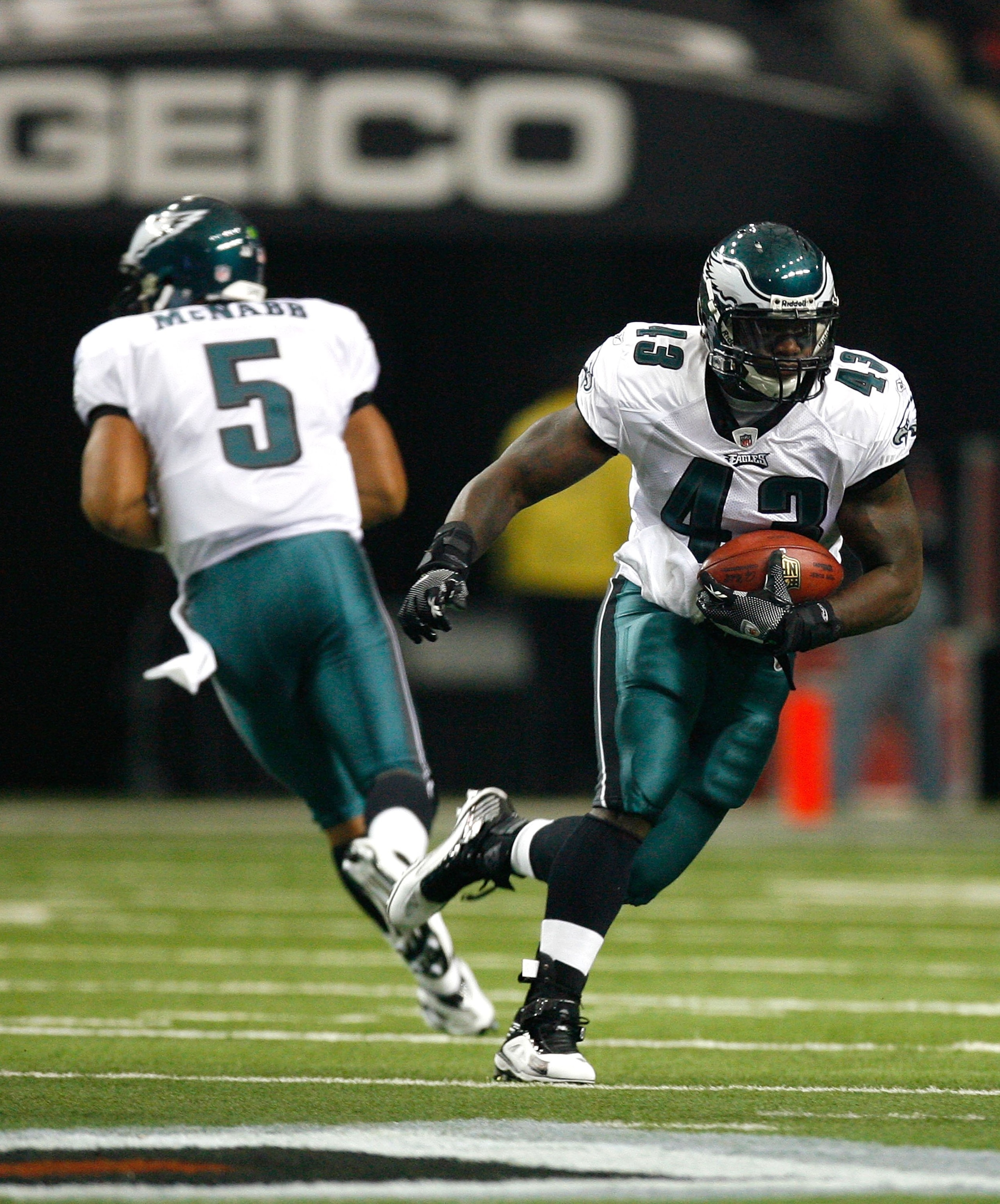ATLANTA - DECEMBER 06:  Quarterback Donovan McNabb #5 and Leonard Weaver #43 of the Philadelphia Eagles against the Atlanta Falcons at Georgia Dome on December 6, 2009 in Atlanta, Georgia.  (Photo by Kevin C. Cox/Getty Images)
