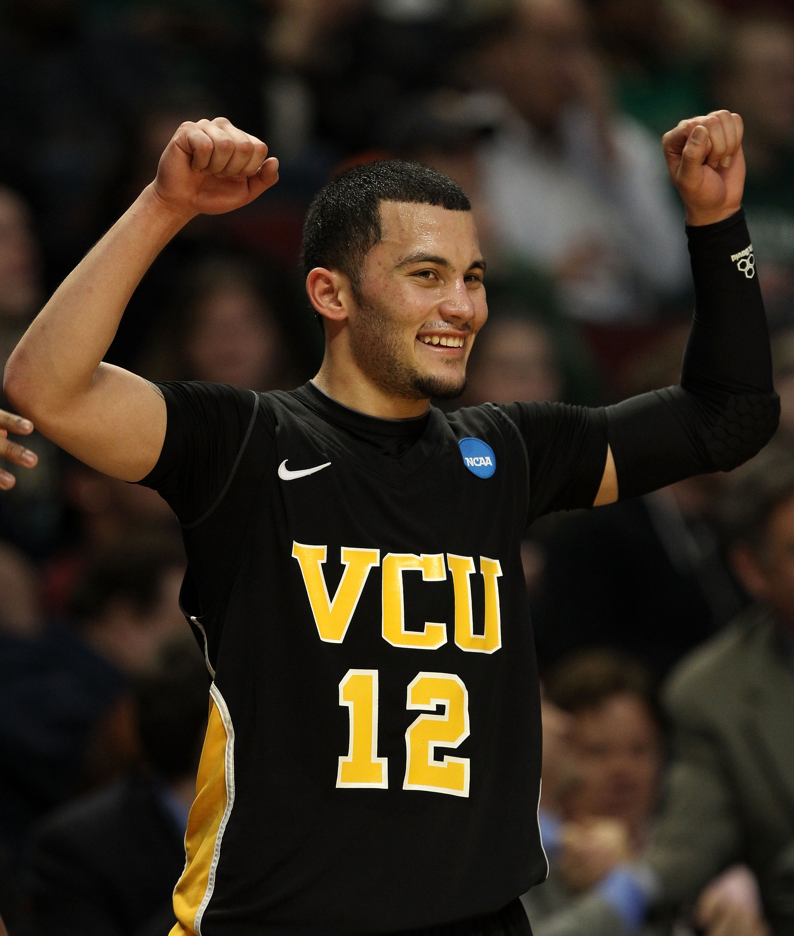 CHICAGO, IL - MARCH 20:  Joey Rodriguez #12 of the Virginia Commonwealth Rams celebrates as he leaves the game in the second half of the game against the Purdue Boilermakers during the third round of the 2011 NCAA men's basketball tournament at the United