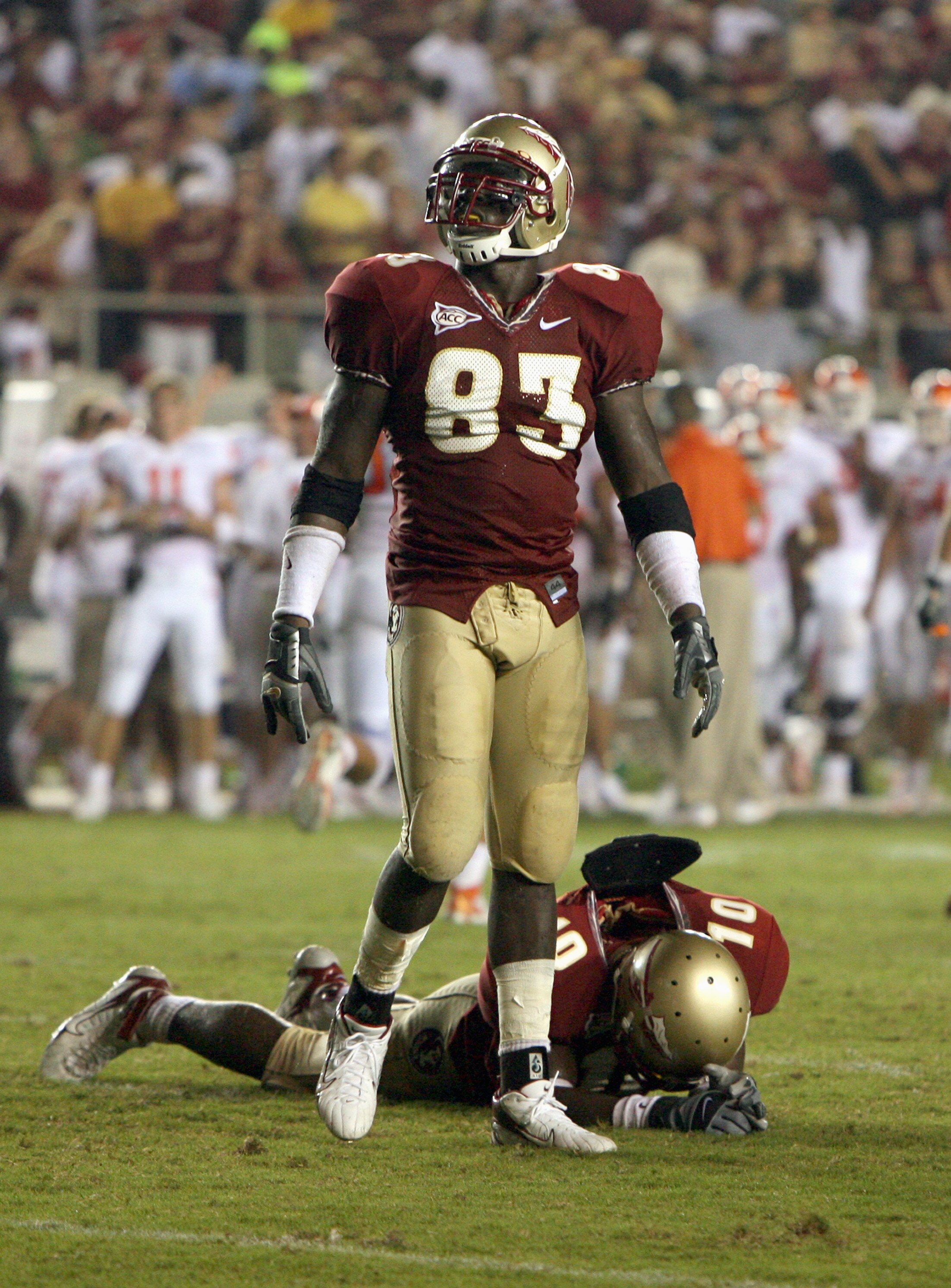 TALLAHASSEE, FL - SEPTEMBER 16:  Lawrence Timmons#83 of the Florida State Seminoles stands on the field over Eugene Hayes #10 during the game against the Clemson Tigers at Doak Campbell Stadium on September 16, 2006 in Tallahassee, Florida. Clemson defeat