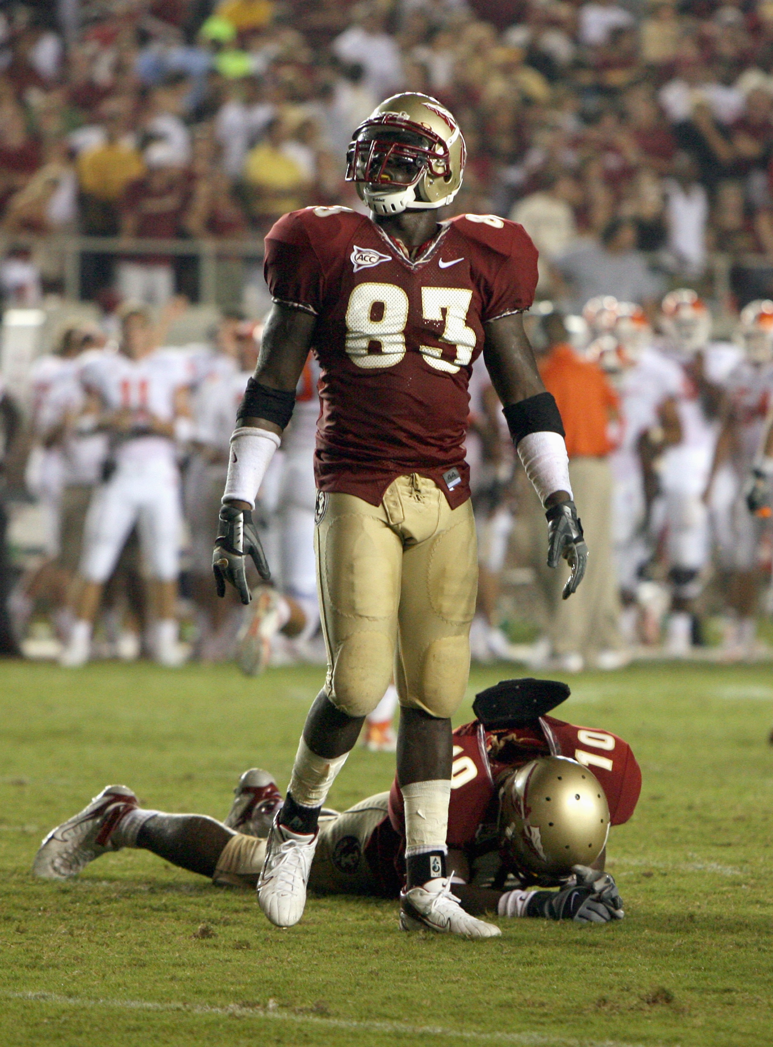TALLAHASSEE, FL - SEPTEMBER 16:  Lawrence Timmons#83 of the Florida State Seminoles stands on the field over Eugene Hayes #10 during the game against the Clemson Tigers at Doak Campbell Stadium on September 16, 2006 in Tallahassee, Florida. Clemson defeat