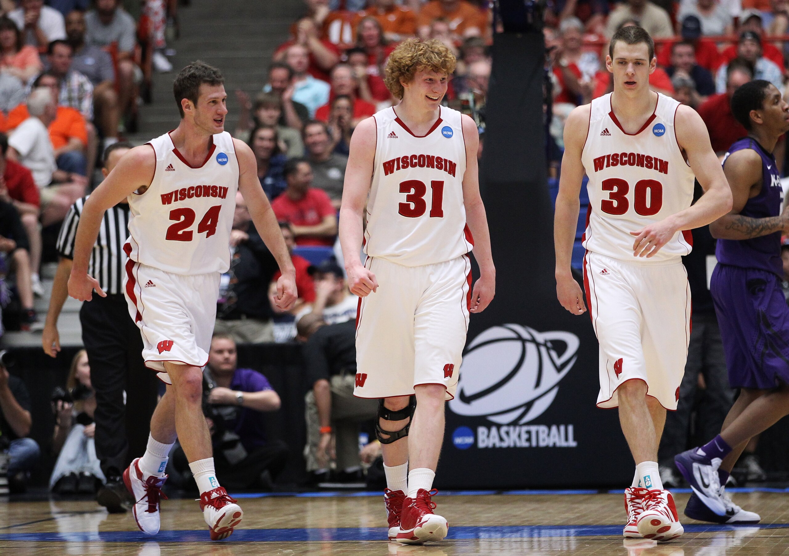 TUCSON, AZ - MARCH 19:  Tim Jarmusz #24, Mike Bruesewitz #31 and Jon Leuer #30 of the Wisconsin Badgers celebrate during their 70 to 65 victory over the Kansas State Wildcats during the third round of the 2011 NCAA men's basketball tournament at McKale Ce
