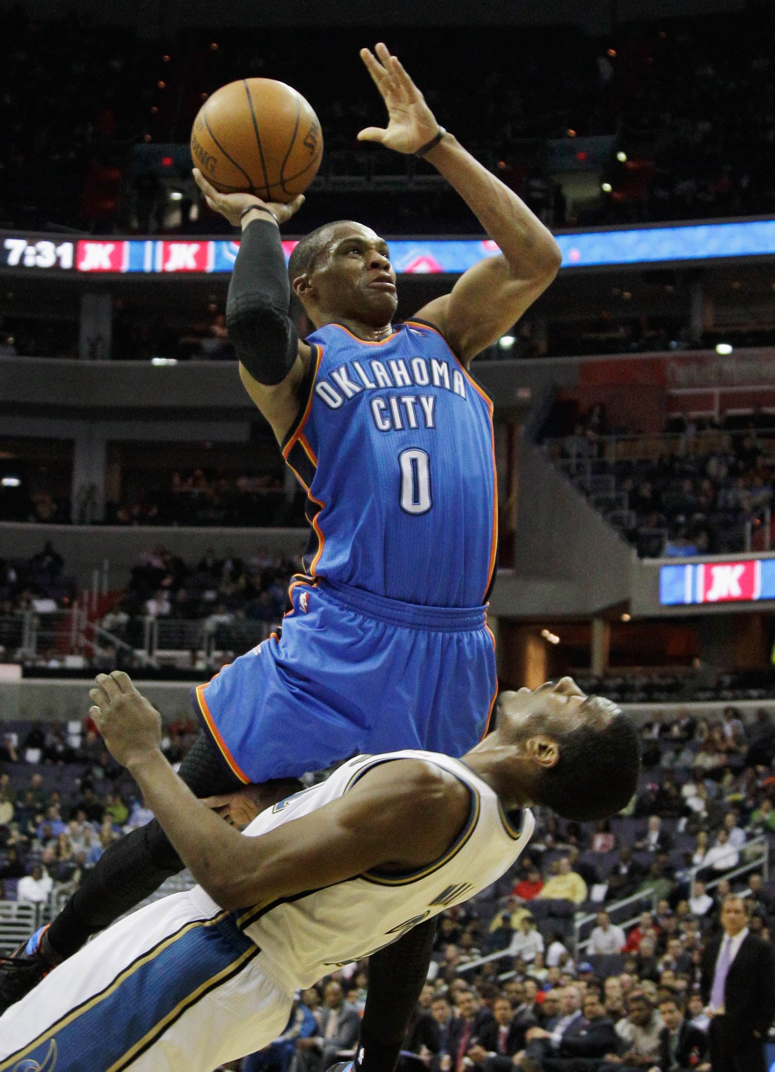 WASHINGTON, DC - MARCH 14: Russell Westbrook #0 of the Oklahoma City Thunder puts up a shot in front of John Wall #2 of the Washington WizardWashington Wizards during the first half at the Verizon Center on March 14, 2011 in Washington, DC. NOTE TO USER: