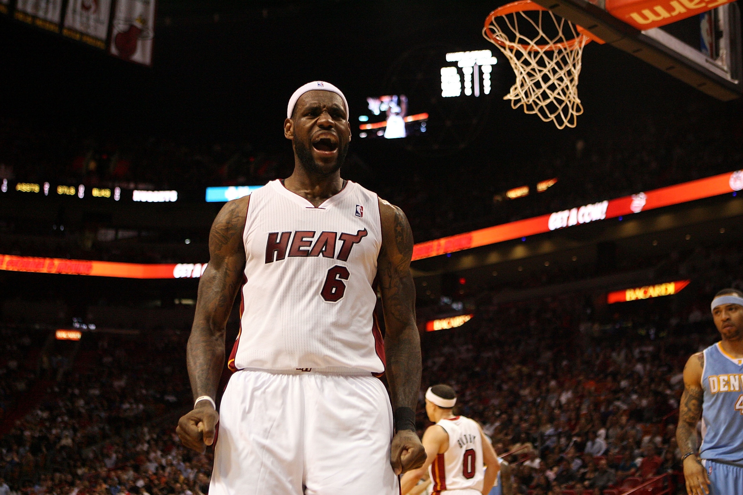 MIAMI, FL - MARCH 19:  Forward LeBron James #6 of the Miami Heat reacts against the Denver Nuggets at American Airlines Arena on March 19, 2011 in Miami, Florida.  The Heat defeated the Nuggets 103-98. NOTE TO USER: User expressly acknowledges and agrees