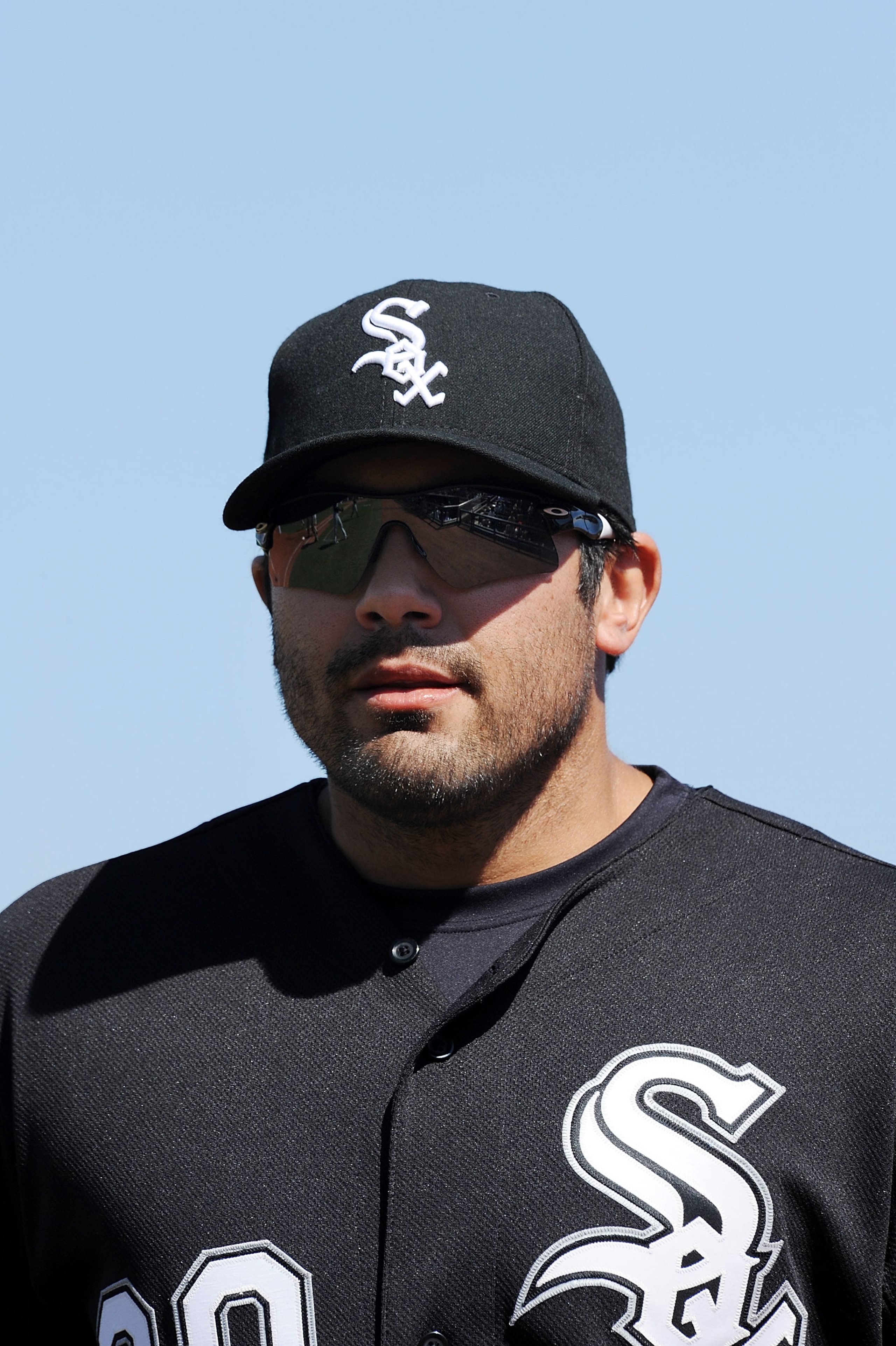 GOODYEAR, AZ - MARCH 02:  Carlos Quentin #20 of the Chicago White Sox runs in from right field against the Cincinnati Reds during a spring training game at Goodyear Ballpark on March 2, 2011 in Goodyear, Arizona.  (Photo by Norm Hall/Getty Images)