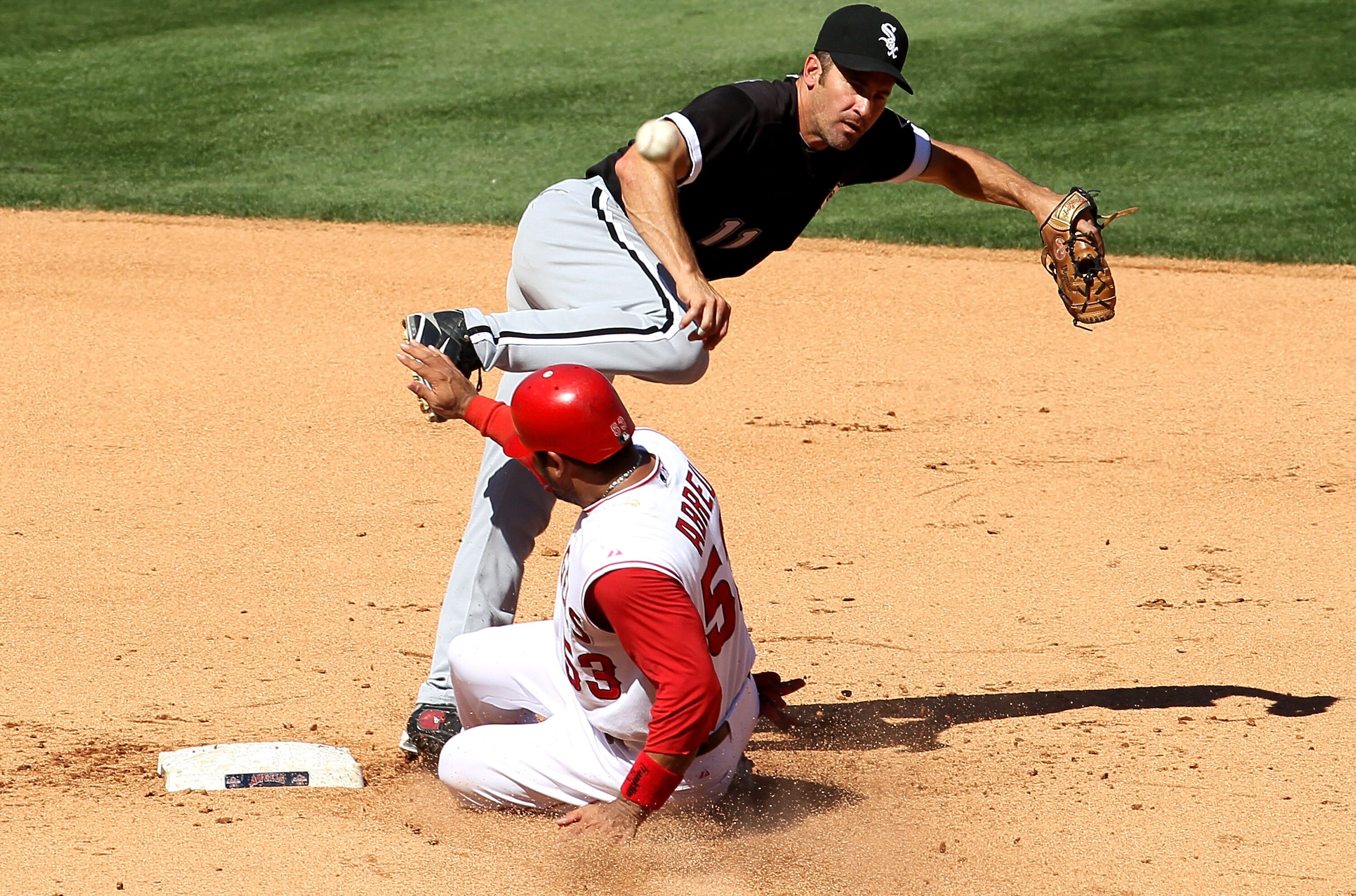 ANAHEIM, CA - SEPTEMBER 26:  Second baseman Omar Vizquel #11 of the Chicago White Sox throws to first to complete a double play after forcing out Bobby Abreu #53 of the Los Angeles Angels of Anaheim to end the fifth inning on September 26, 2010 at Angel S