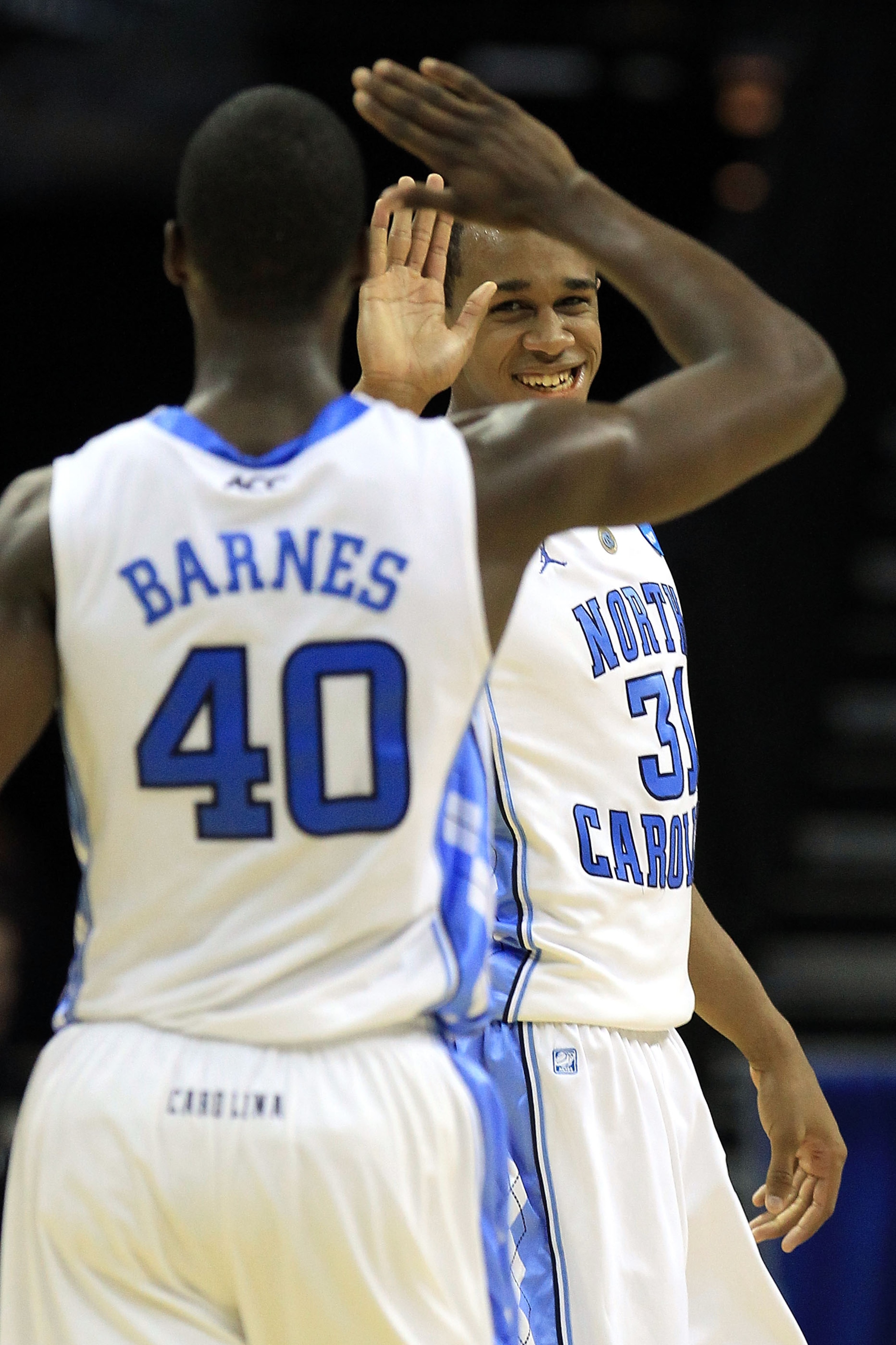 CHARLOTTE, NC - MARCH 20:  John Henson #31 and Harrison Barnes #40 of the North Carolina Tar Heels react in the second half while taking on the Washington Huskies during the third round of the 2011 NCAA men's basketball tournament at Time Warner Cable Are