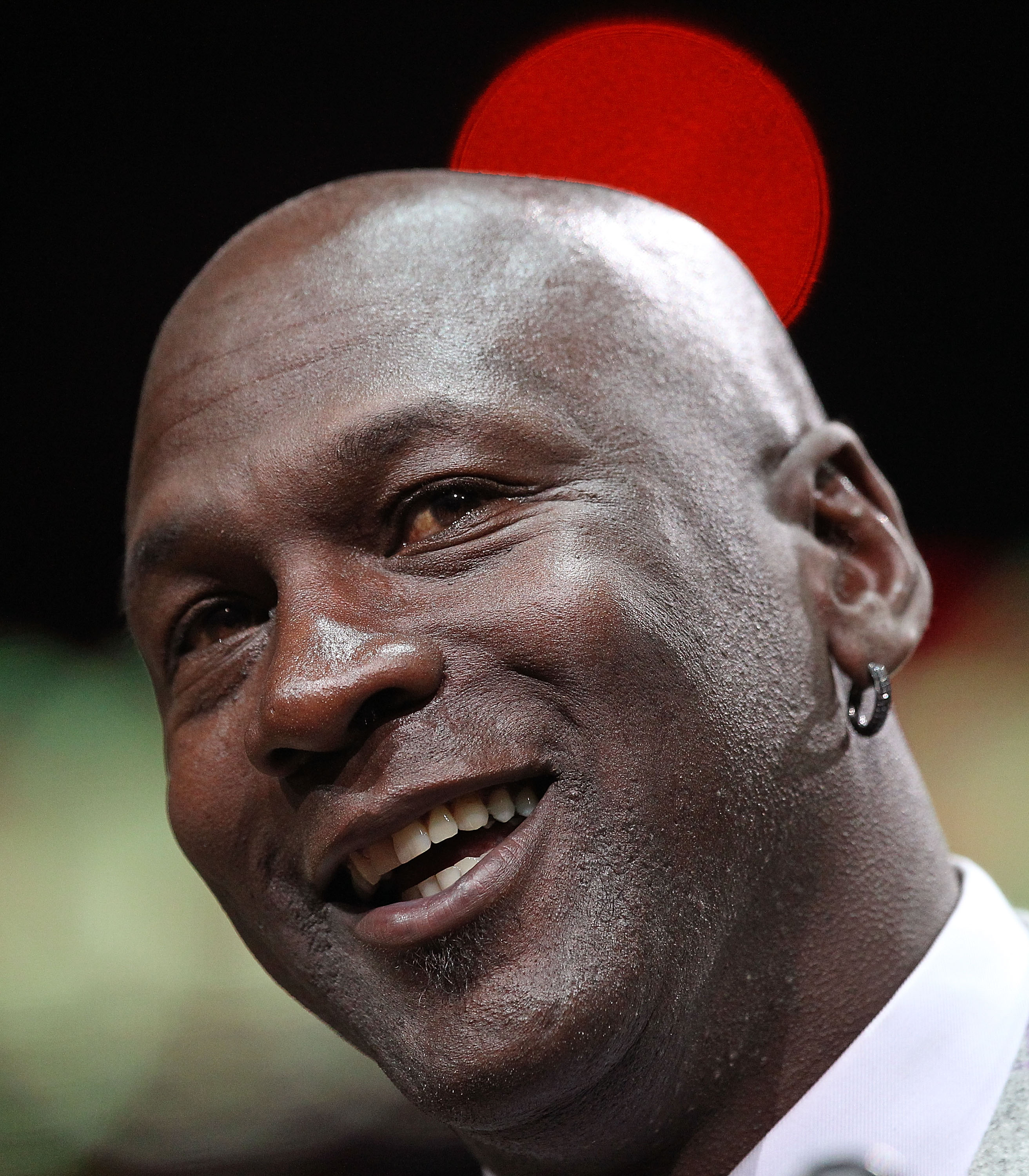 CHICAGO, IL - MARCH 12: Former player Michael Jordan of the Chicago Bulls addresses the crowd during a 20th anniversary recognition ceremony of the Bulls 1st NBA Championship in 1991 during half-time of a game bewteen the Bulls and the Utah Jazz at the Un