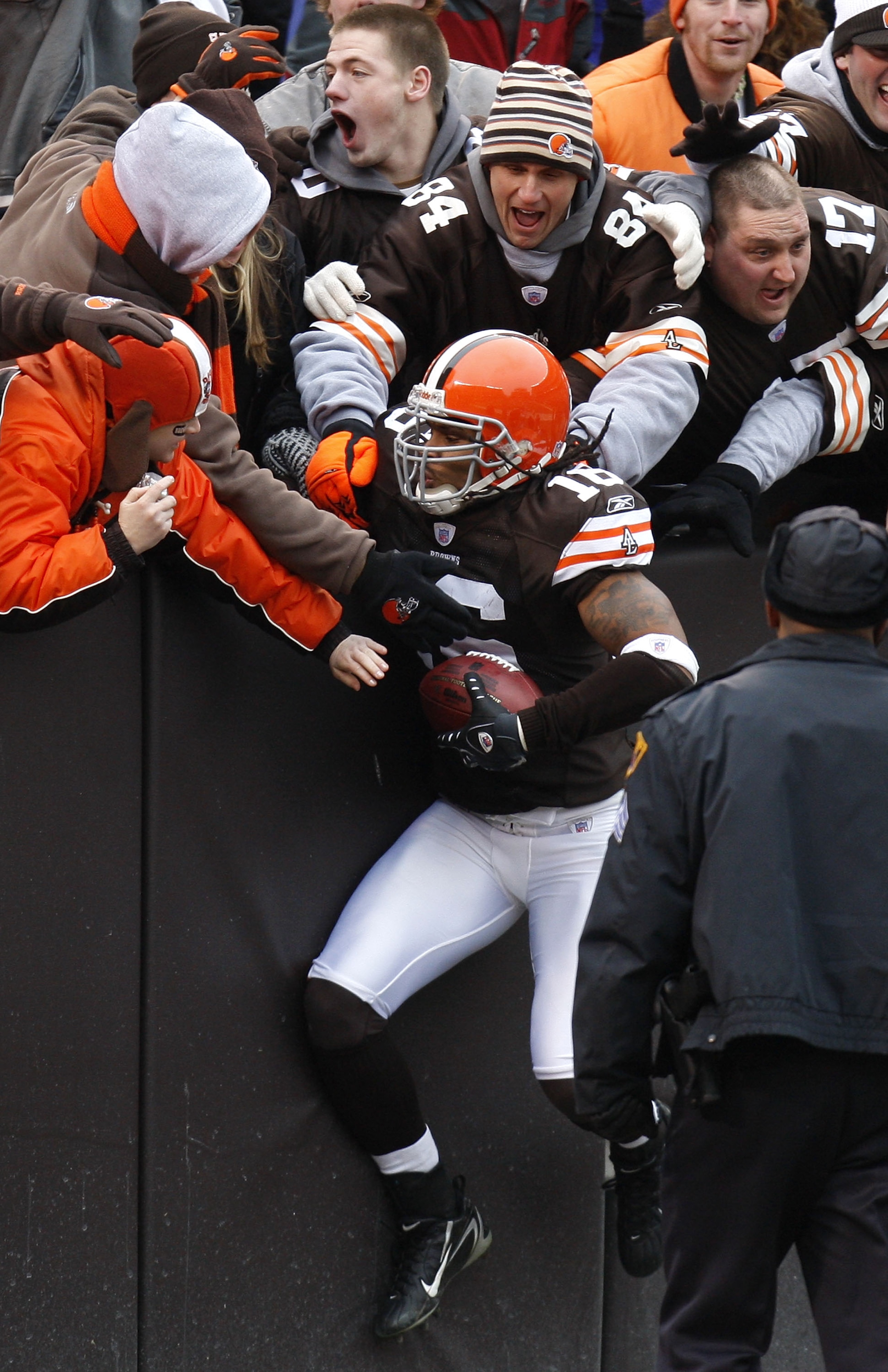 CLEVELAND - DECEMBER 30:  Joshua Cribbs #16 of the Cleveland Browns jumps into the stands to celebrate a first quarter punt return for a touchdown against the San Francisco 49ers on December 30, 2007 at Cleveland Browns Stadium in Cleveland, Ohio. Clevela