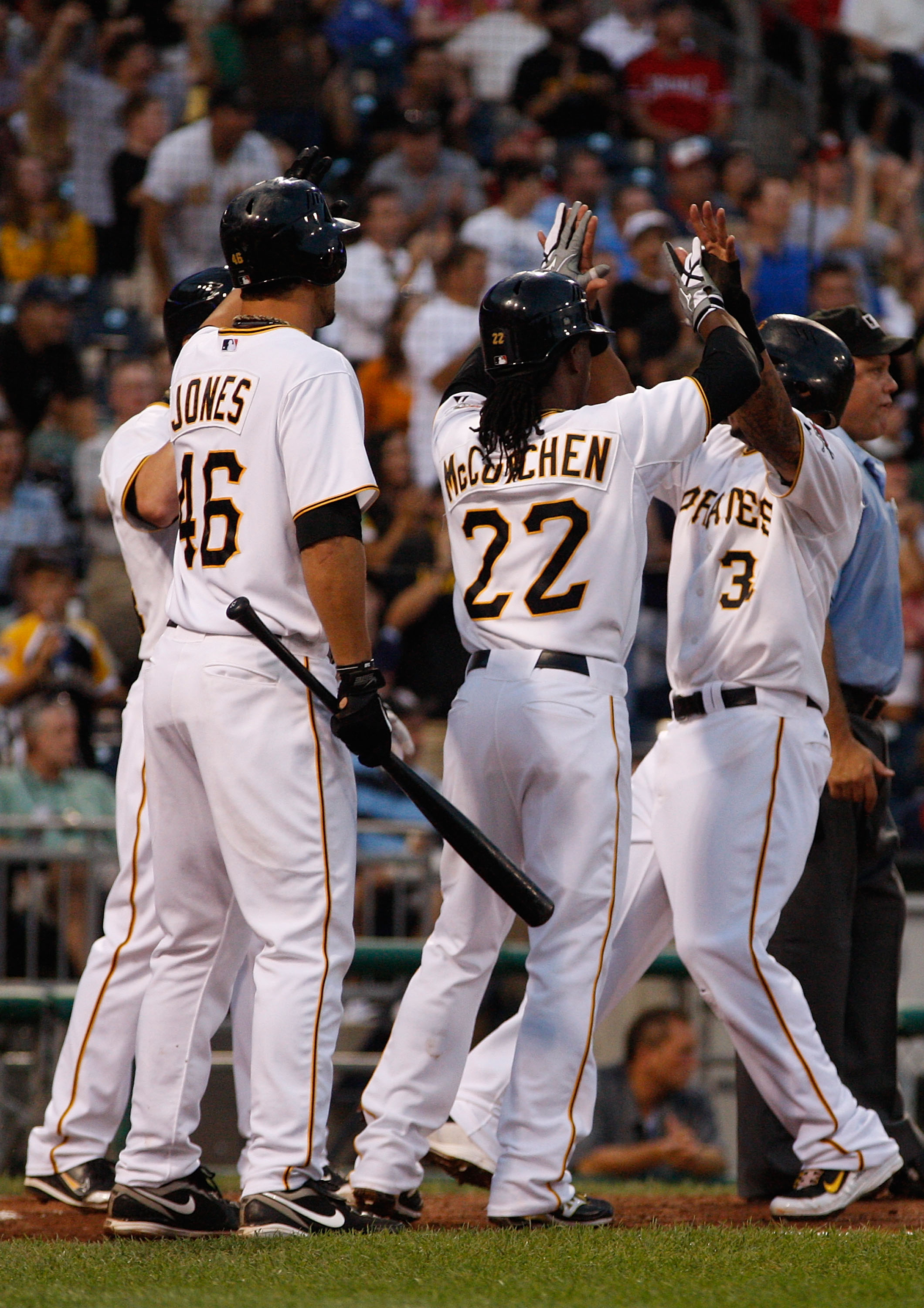 PITTSBURGH - AUGUST 25:  Jose Tabata #31 of the Pittsburgh Pirates celebrates with teammates Andrew McCutchen #22 and Garrett Jones #46 after scoring against the St. Louis Cardinals during the game on August 25, 2010 at PNC Park in Pittsburgh, Pennsylvani