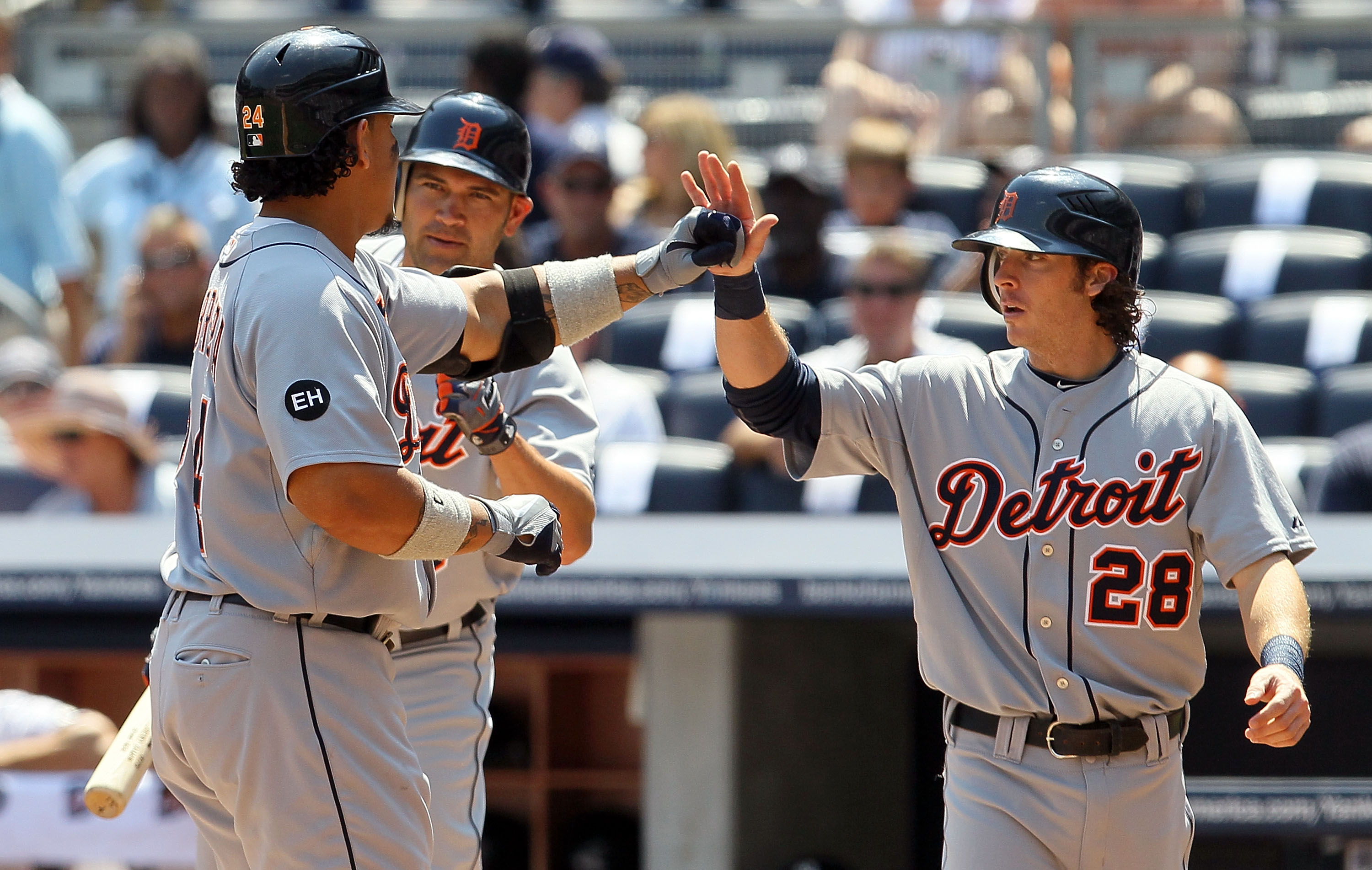 NEW YORK - AUGUST 19:  Miguel Cabrera #24 of the Detroit Tigers celebrates his first inning two run home run against the New York Yankees with teammates Johnny Damon #18 and Will Rhymes #28 on August 19, 2010 at Yankee Stadium in the Bronx borough of New