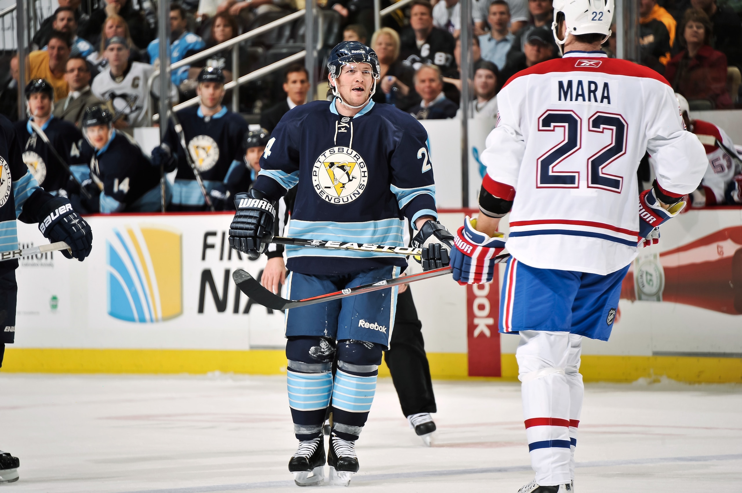 PITTSBURGH, PA - MARCH 12:  Matt Cooke #24 of the Pittsburgh Penguins exchanges words with Paul Mara #22 of the Montreal Canadiens on March 12, 2011 at CONSOL Energy Center in Pittsburgh, Pennsylvania.  (Photo by Jamie Sabau/Getty Images)