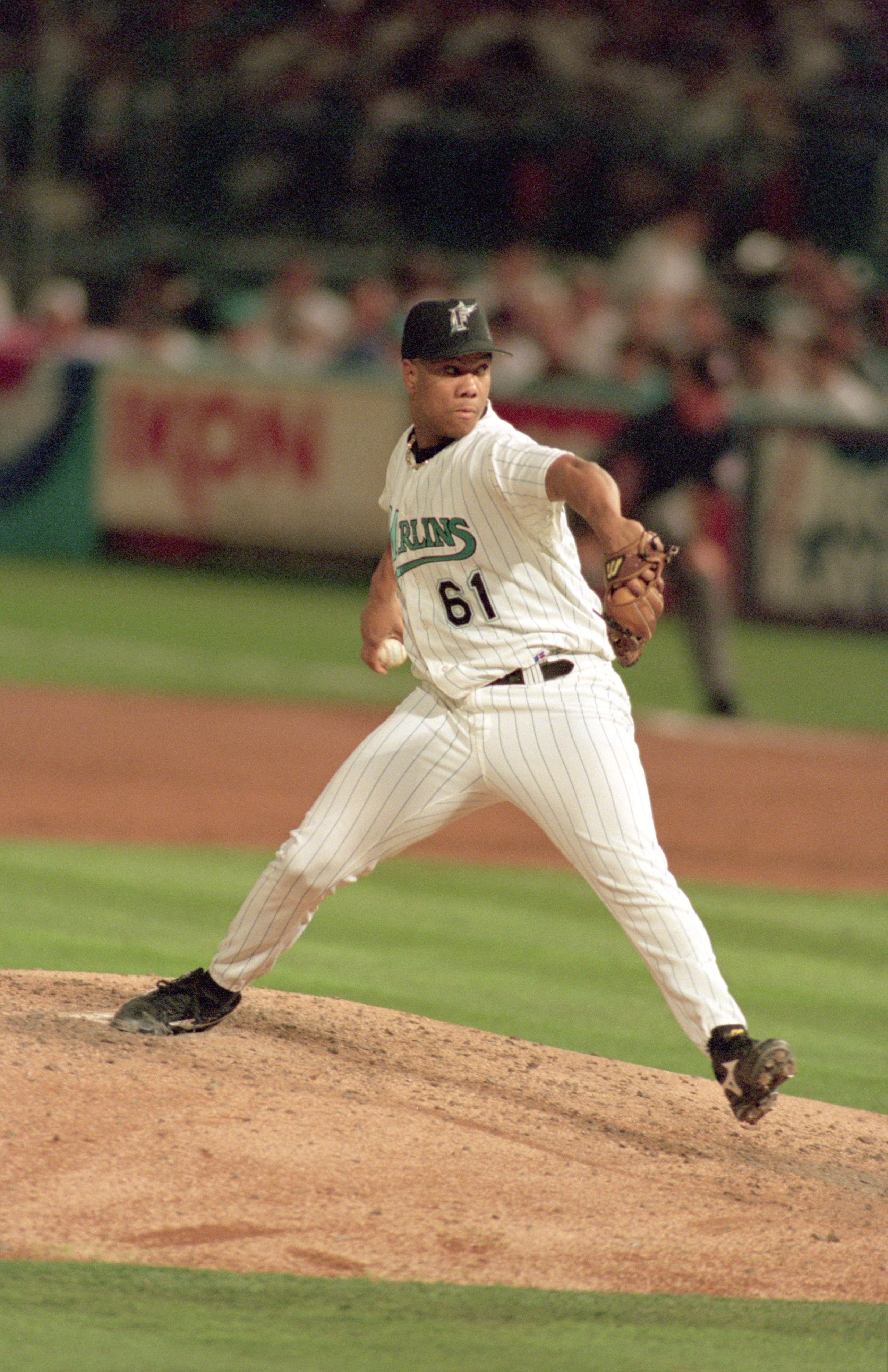 MIAMI - OCTOBER 18:  Livan Hernandez #61 of the Florida Marlins pitches during Game one of the 1997 World Series against the Cleveland Indians at Pro Player Stadium on October 18, 1997 in Miami, Florida. The Marlins defeated the Indians 7-4. (Photo by Jed