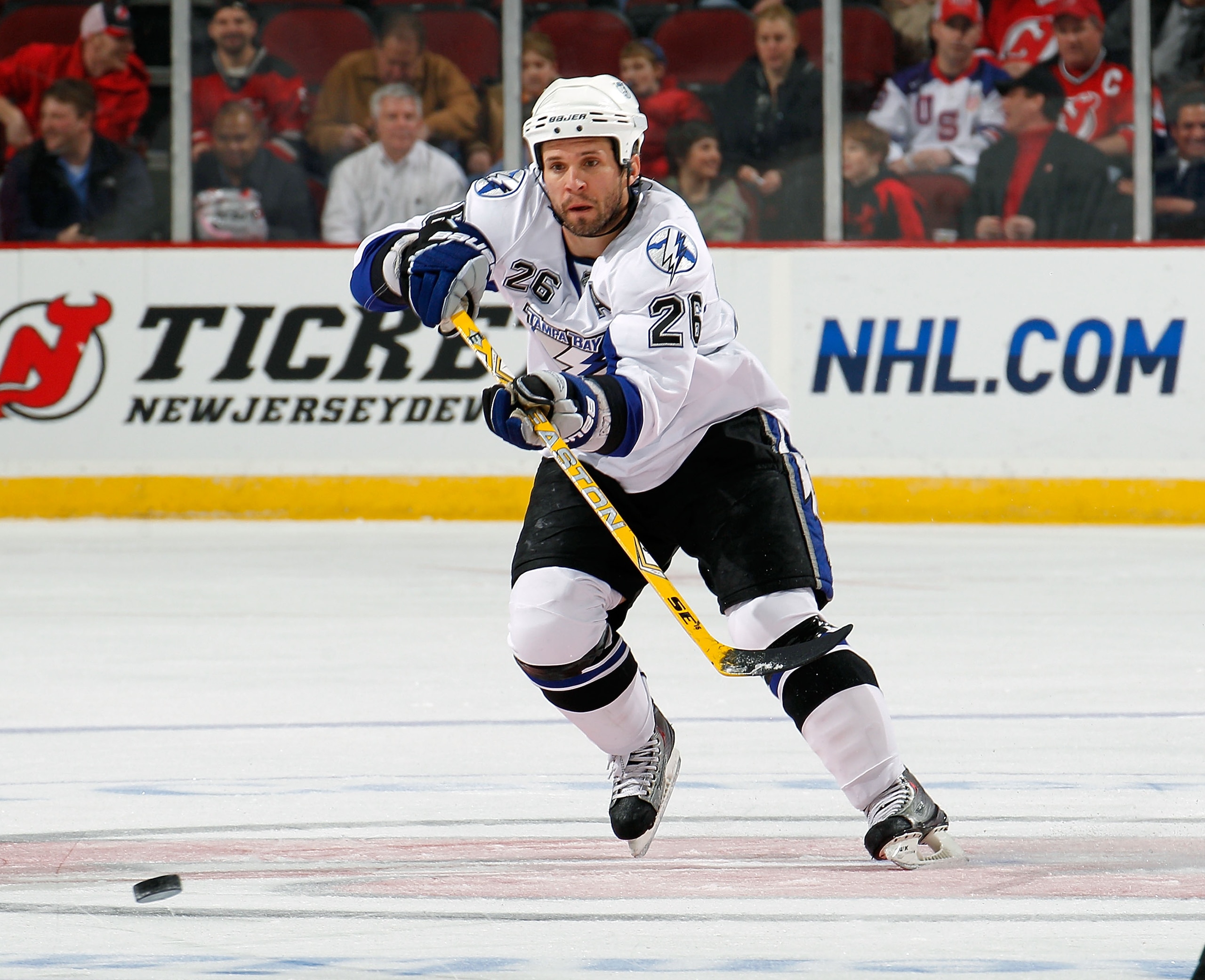 NEWARK, NJ - MARCH 02:  Martin St. Louis #26 of the Tampa Bay Lightning passes during an NHL hockey game against the New Jersey Devils at the Prudential Center on March 2, 2011 in Newark, New Jersey.  (Photo by Paul Bereswill/Getty Images)