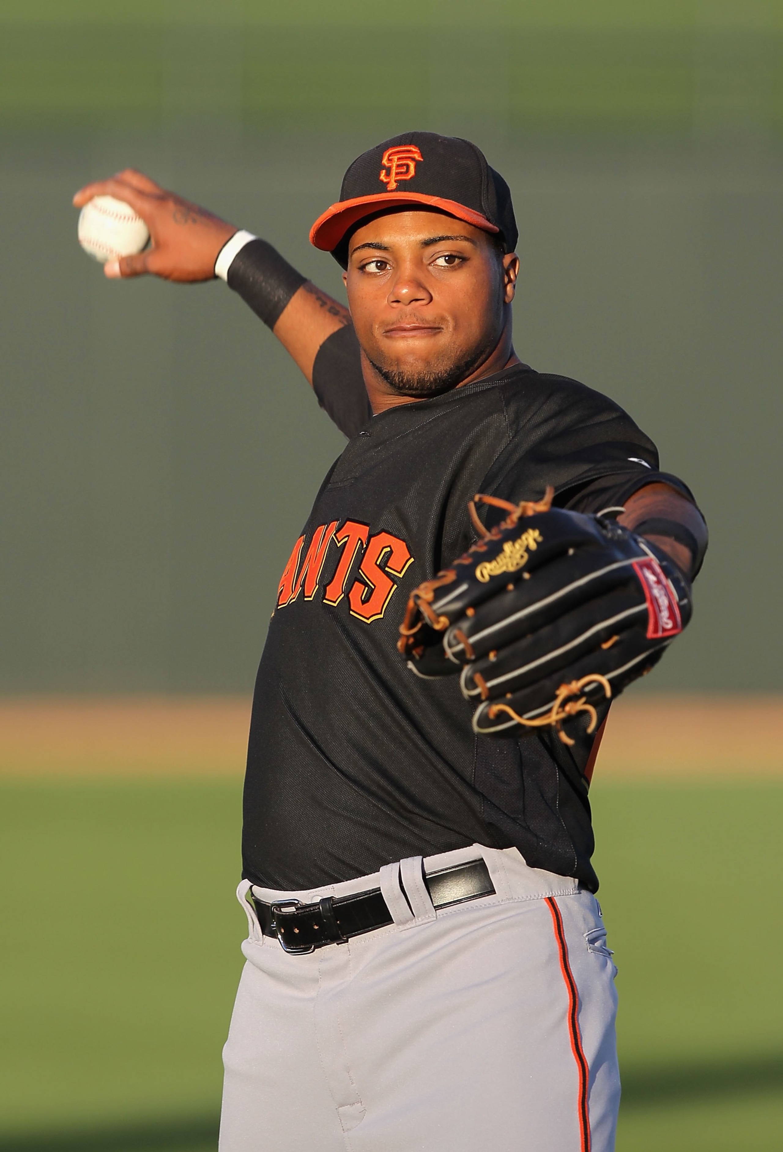 SURPRISE, AZ - MARCH 15:  Darren Ford #47 of the San Francisco Giants warms up before the MLB spring training game against the Texas Rangers at Surprise Stadium on March 15, 2010 in Surprise, Arizona.  The Giants defeated the Rangers 8-5.  (Photo by Chris