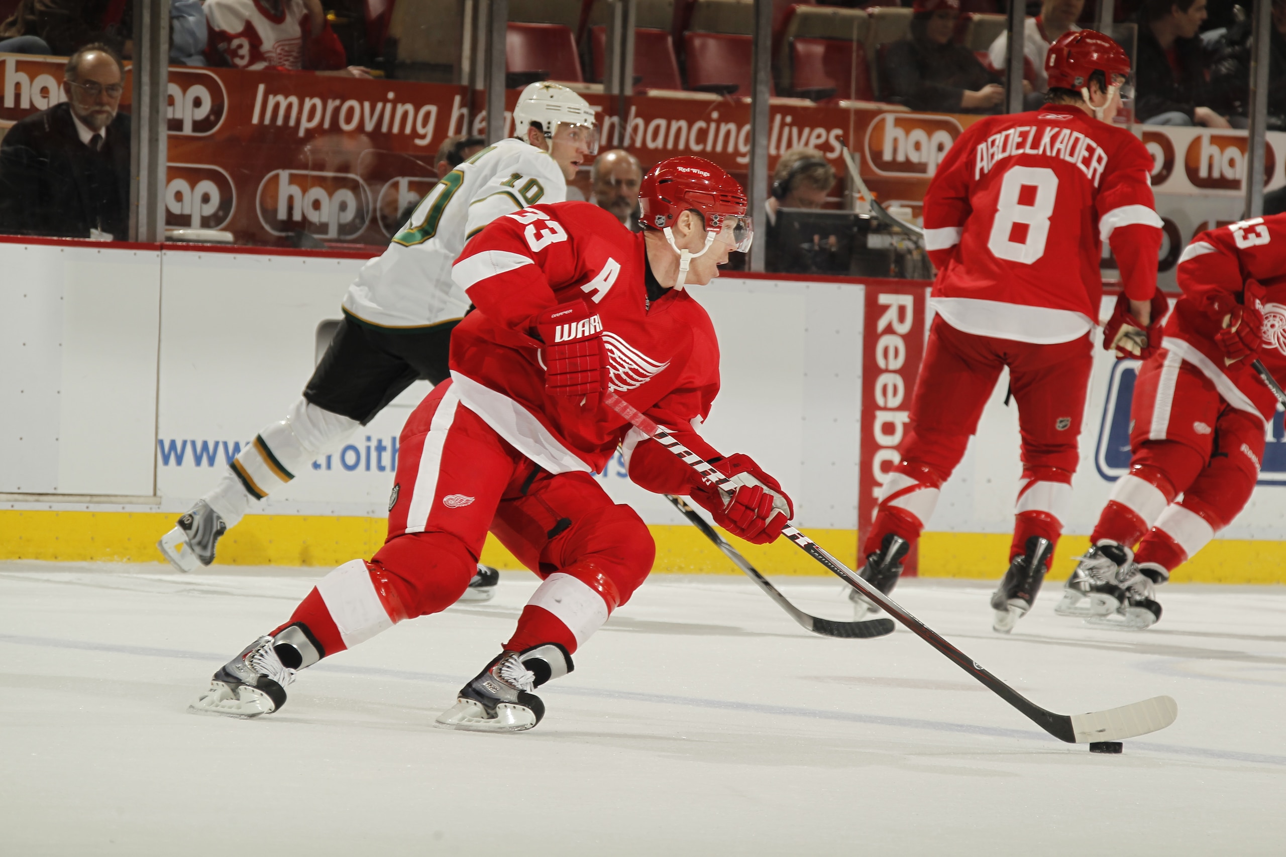 DETROIT, MI - FEBRUARY 24:  Kris Draper #33 of the Detroit Red Wings skates with the puck against the Dallas Stars on February 24, 2011 at Joe Louis Arena in Detroit, Michigan.  (Photo by Gregory Shamus/Getty Images)