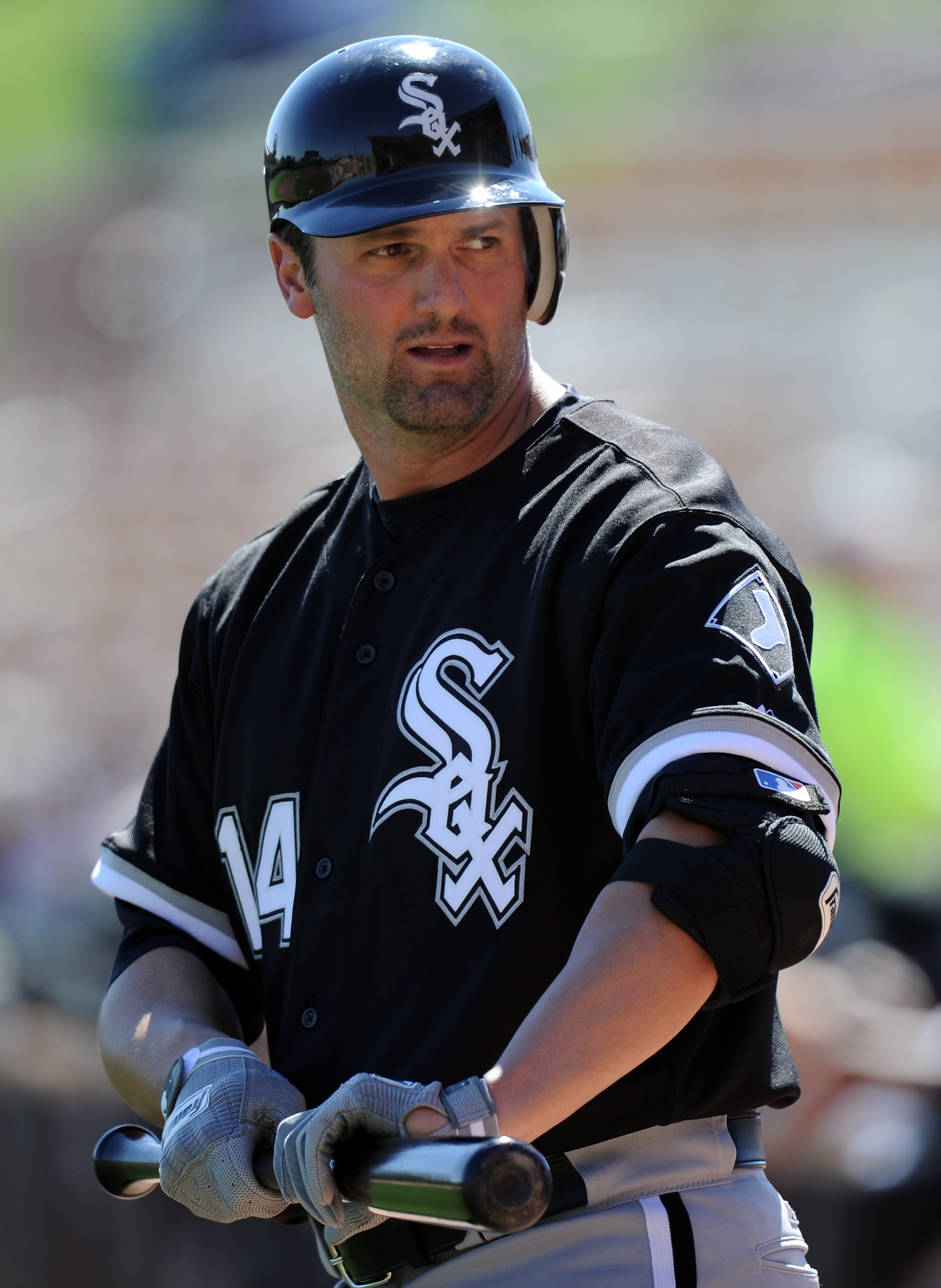 PHOENIX, AZ - FEBRUARY 28:  Paul Konerko #14 of the Chicago White Sox warms up against the Los Angeles Dodgers during spring training at Camelback Ranch on February 28, 2011 in Phoenix, Arizona.  (Photo by Harry How/Getty Images)