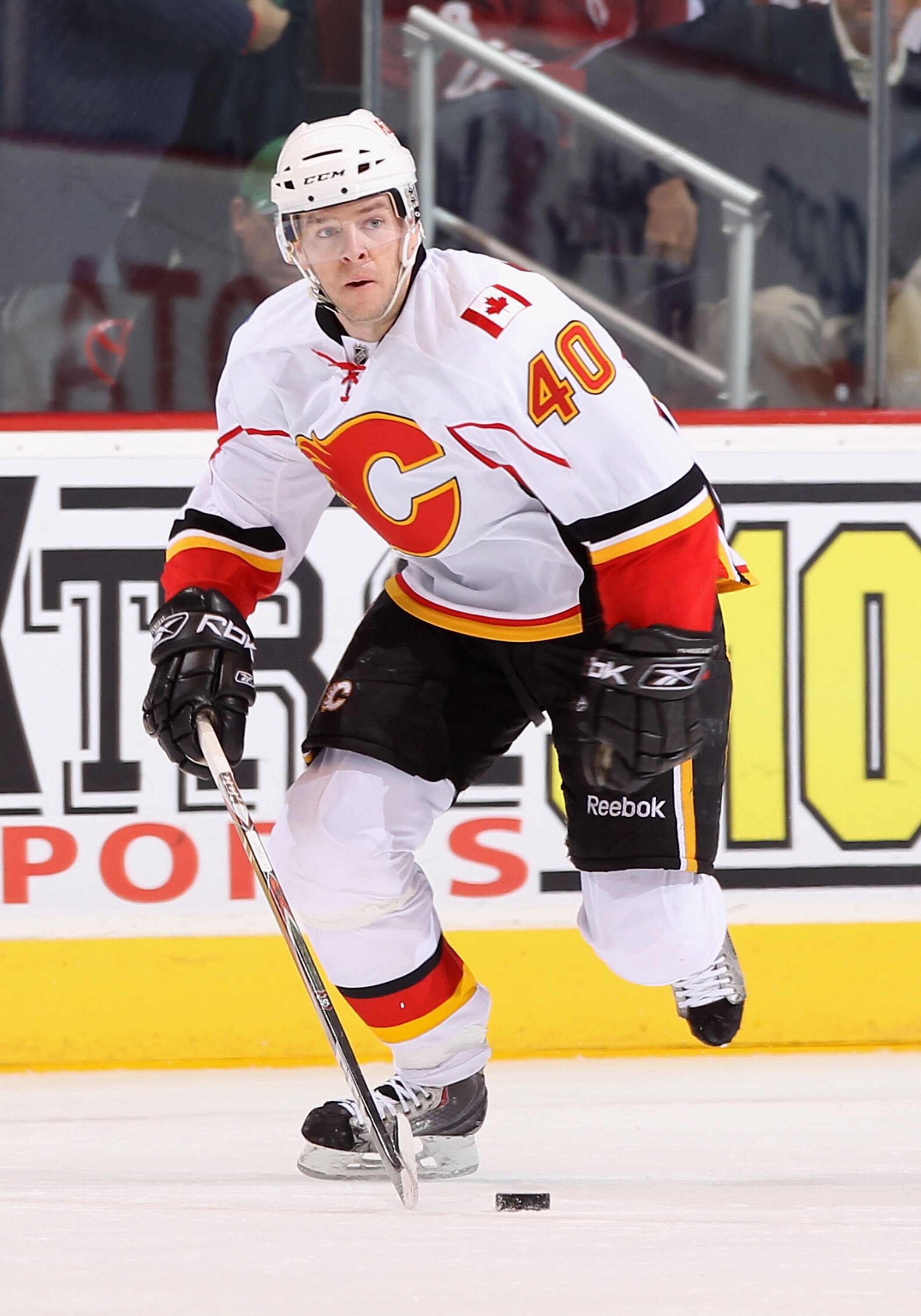GLENDALE, AZ - MARCH 10:  Alex Tanguay #40 of the Calgary Flames skates with the puck during the NHL game against the Phoenix Coyotes at Jobing.com Arena on March 10, 2011 in Glendale, Arizona.  The Coyotes defeated the Flames 3-0.  (Photo by Christian Pe