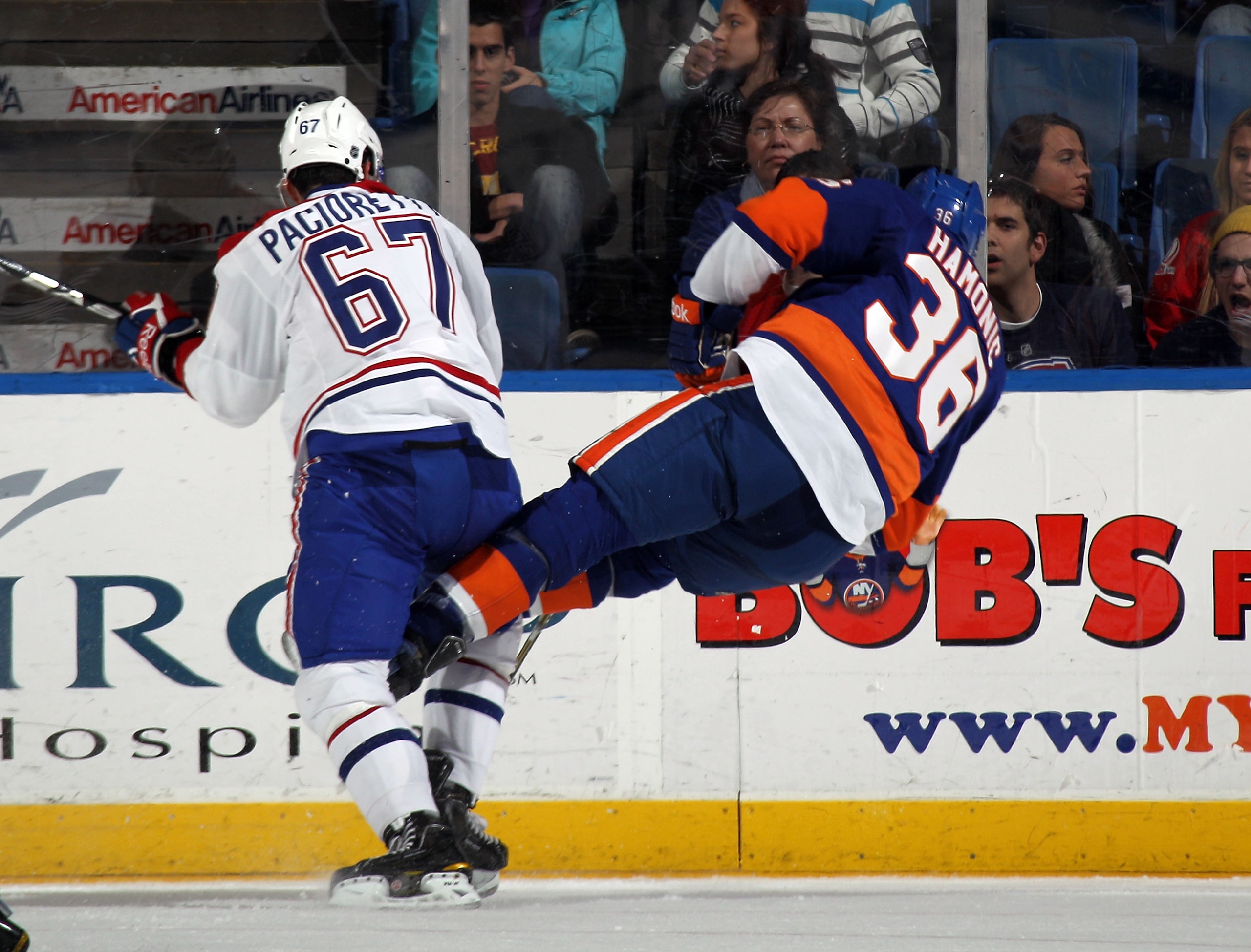UNIONDALE, NY - DECEMBER 26: Travis Hamonic #36 of the New York Islanders skates against Max Pacioretty #67 of the Montreal Canadiens at the Nassau Coliseum on December 26, 2010 in Uniondale, New York. The Islanders defeated the Canadiens 4-1.  (Photo by