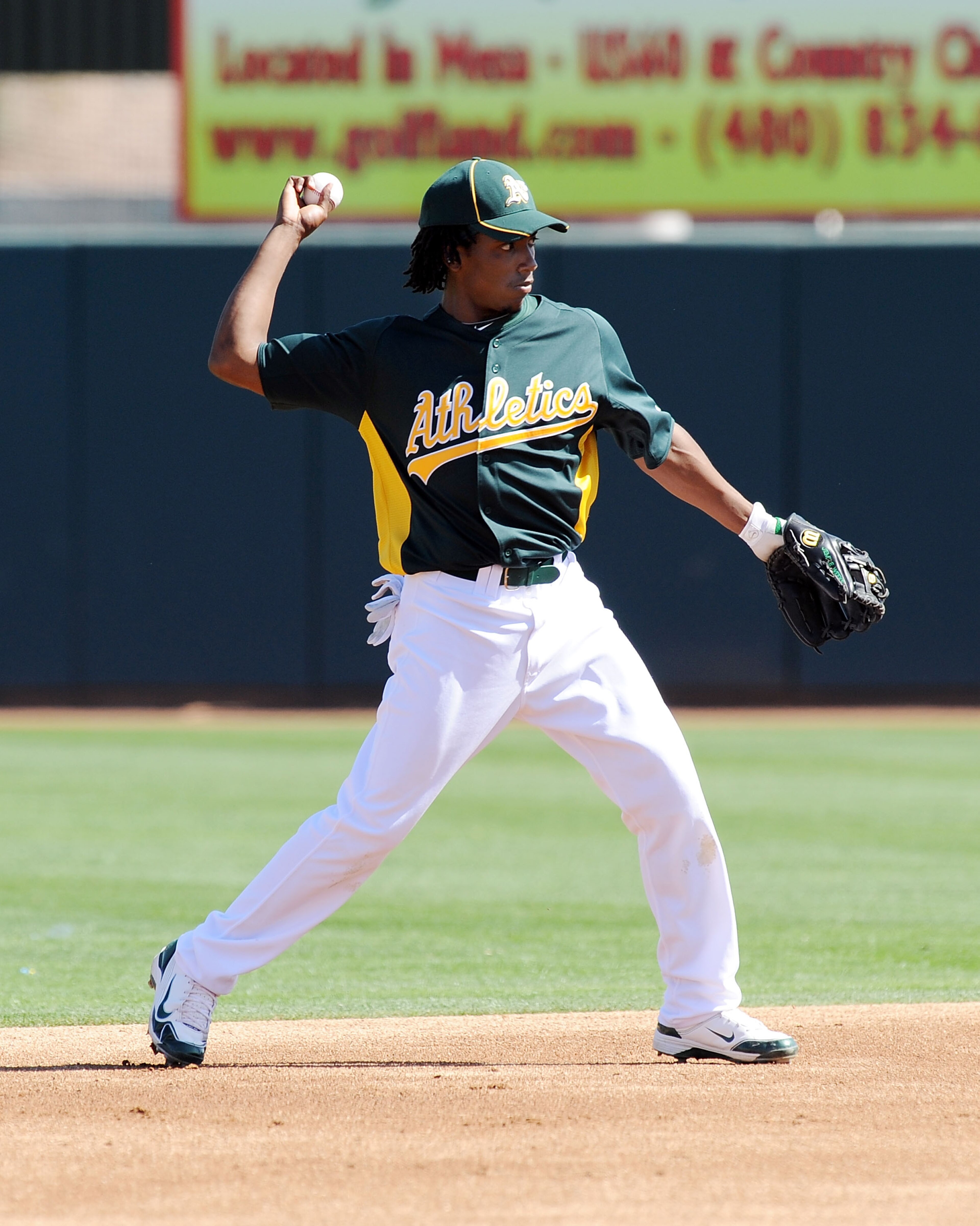 PHOENIX, AZ - MARCH 04: Jemile Weeks #59 of the Oakland Athletics throws the ball to first base against the Texas Rangers at Phoenix Municipal Stadium on March 4, 2011 in Phoenix, Arizona. (Photo by Norm Hall/Getty Images) PHOENIX, AZ - MARCH 04: Jemile Weeks #59 of the Oakland Athletics throws the ball to first base against the Texas Rangers at Phoenix Municipal Stadium on March 4, 2011 in Phoenix, Arizona. (Photo by Norm Hall/Getty Images)