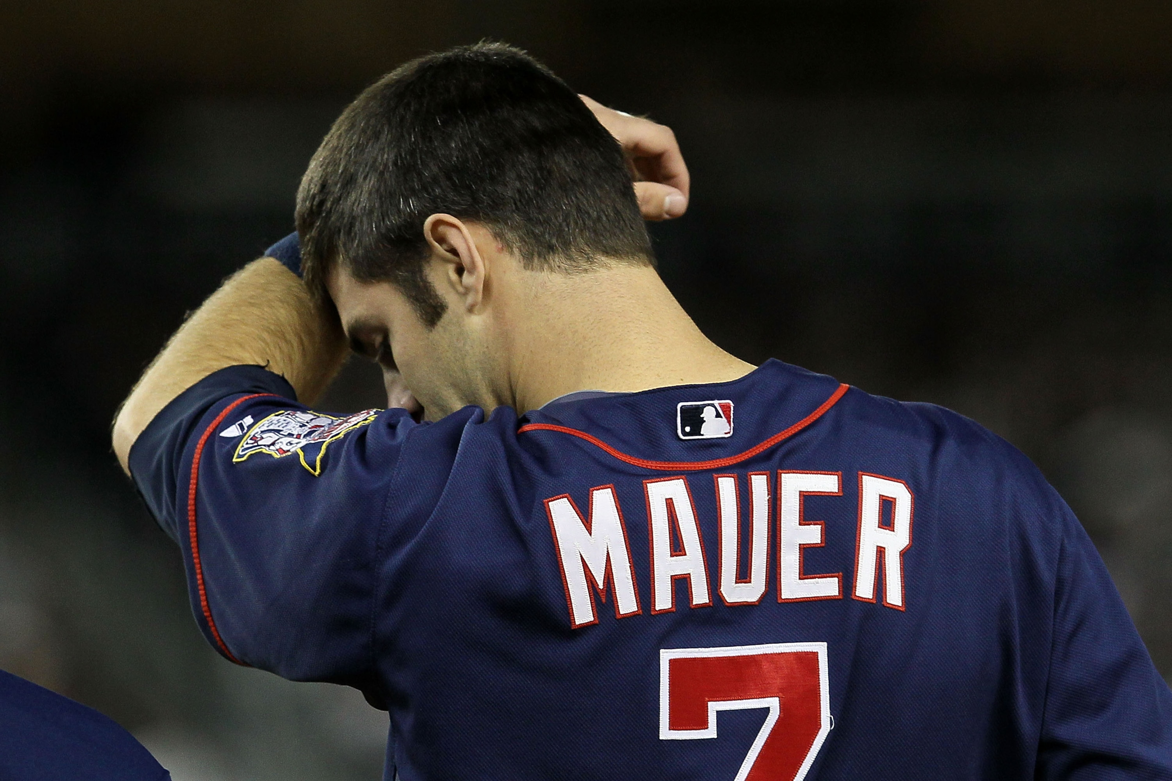 NEW YORK - OCTOBER 09: Joe Mauer #7 of the Minnesota Twins wipes his forehead against the New York Yankees during Game Three of the ALDS part of the 2010 MLB Playoffs at Yankee Stadium on October 9, 2010 in the Bronx borough of New York City. (Photo by NEW YORK - OCTOBER 09: Joe Mauer #7 of the Minnesota Twins wipes his forehead against the New York Yankees during Game Three of the ALDS part of the 2010 MLB Playoffs at Yankee Stadium on October 9, 2010 in the Bronx borough of New York City. (Photo by