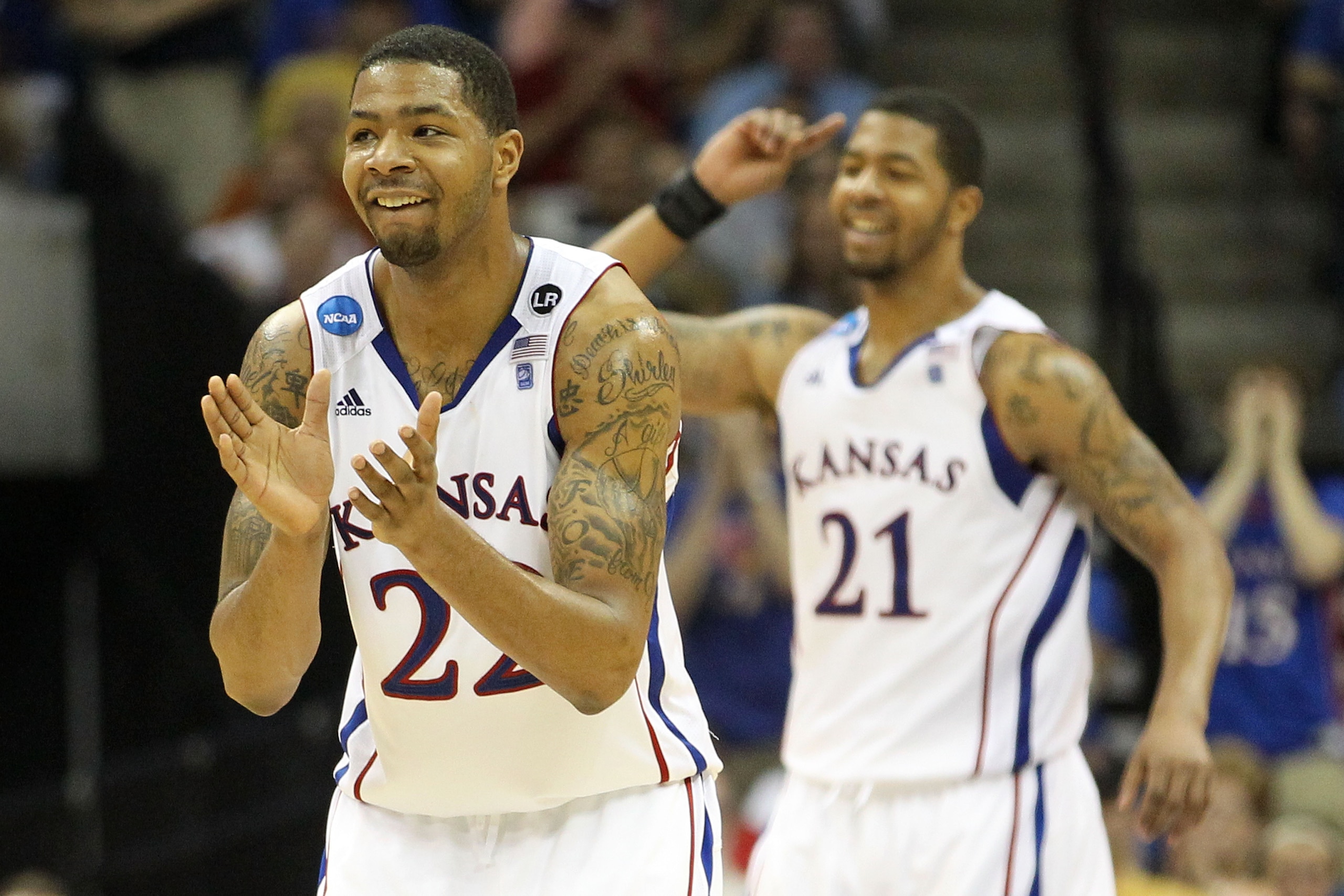 TULSA, OK - MARCH 20:  Marcus Morris #22 and Markieff Morris #21 of the Kansas Jayhawks celebrate after a play against the Illinois Fighting Illini during the third round of the 2011 NCAA men's basketball tournament at BOK Center on March 20, 2011 in Tuls