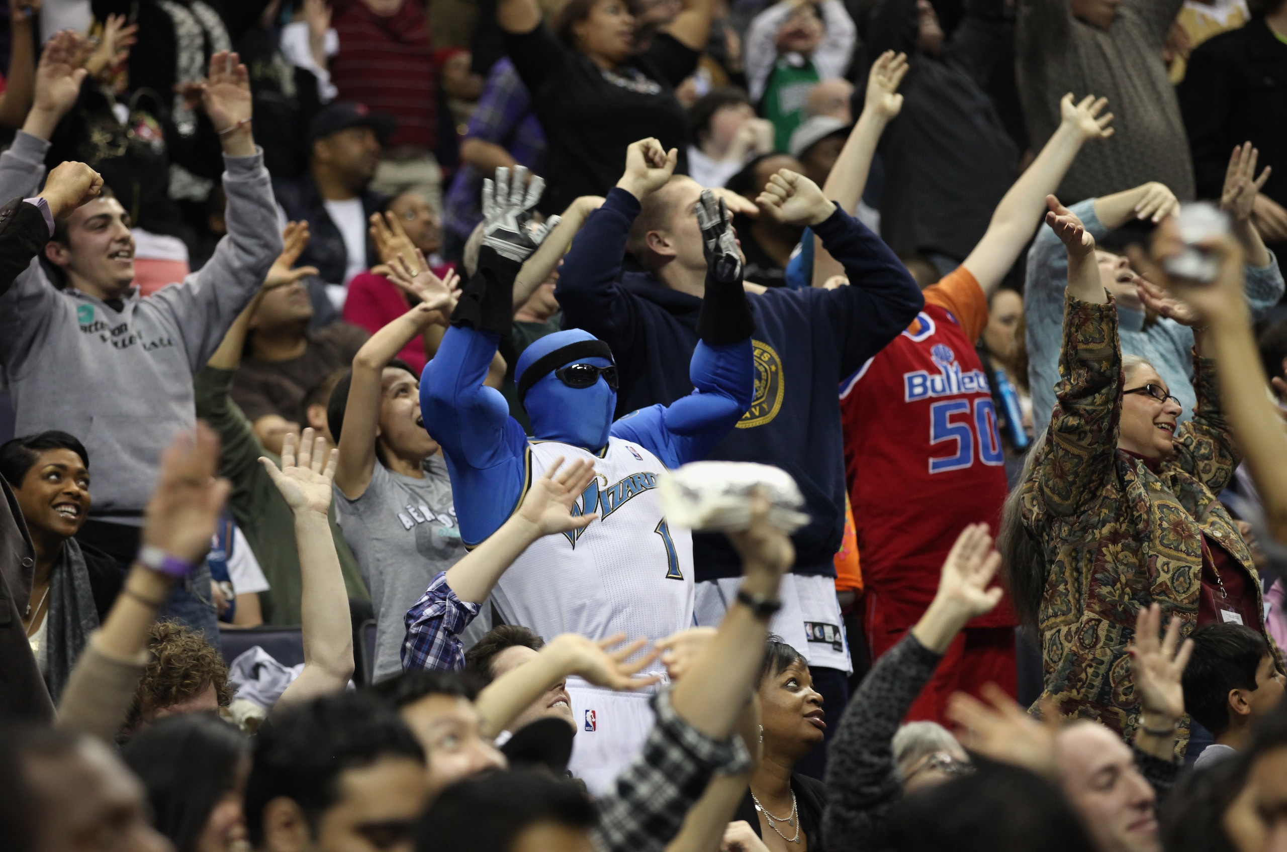 WASHINGTON, DC - FEBRUARY 26: The Washington Wizards mascot G-Man cheers with fans during a timeout between the Wizards and Dallas Mavericks game at the Verizon Center on February 26, 2011 in Washington, DC. NOTE TO USER: User expressly acknowledges and a