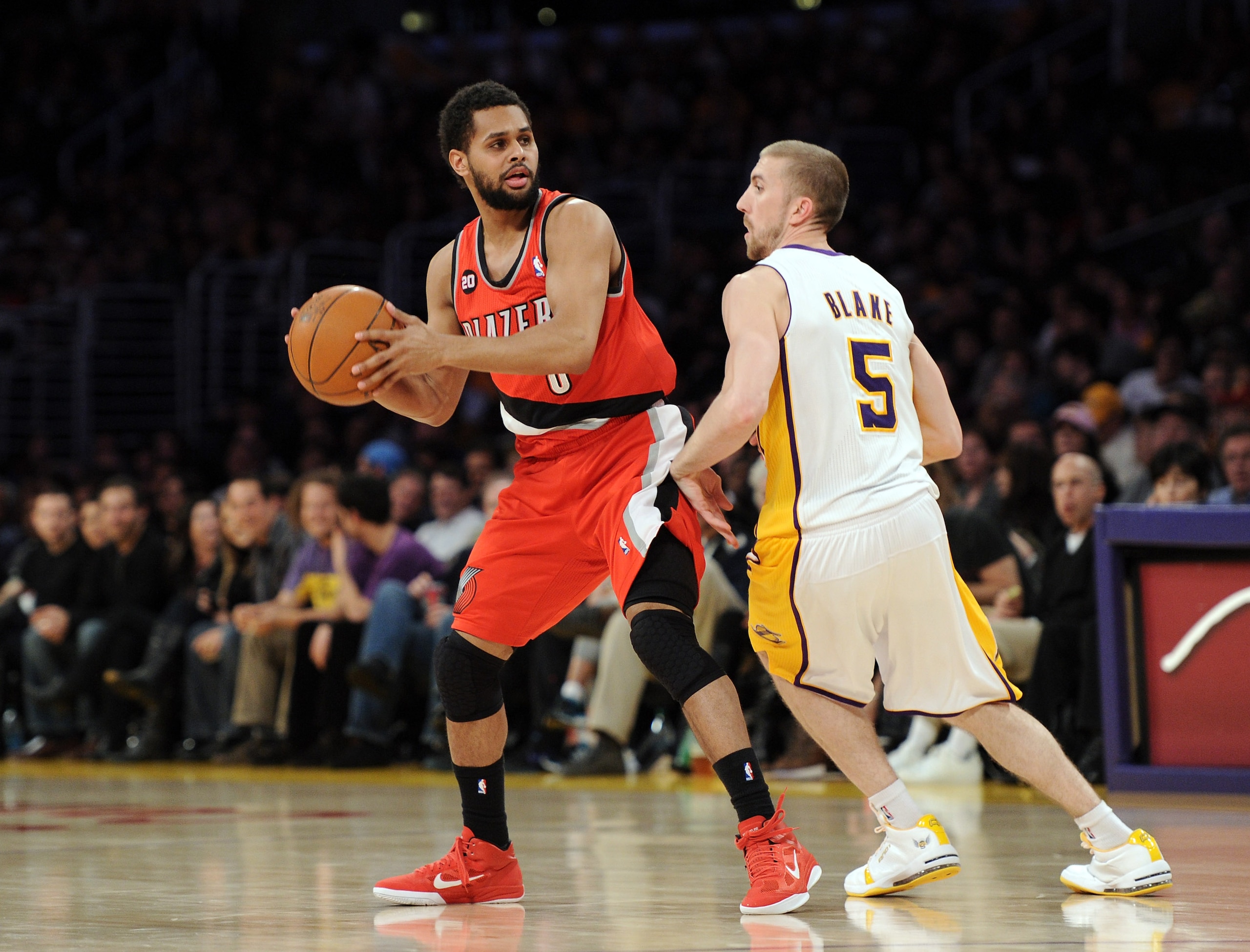 LOS ANGELES, CA - MARCH 20:  Patrick Mills #8 of the Portland Trail Blazers looks to pass in front of Steve Blake #5 of the Los Angeles Lakers at the Staples Center on March 20, 2011 in Los Angeles, California.  NOTE TO USER: User expressly acknowledges a