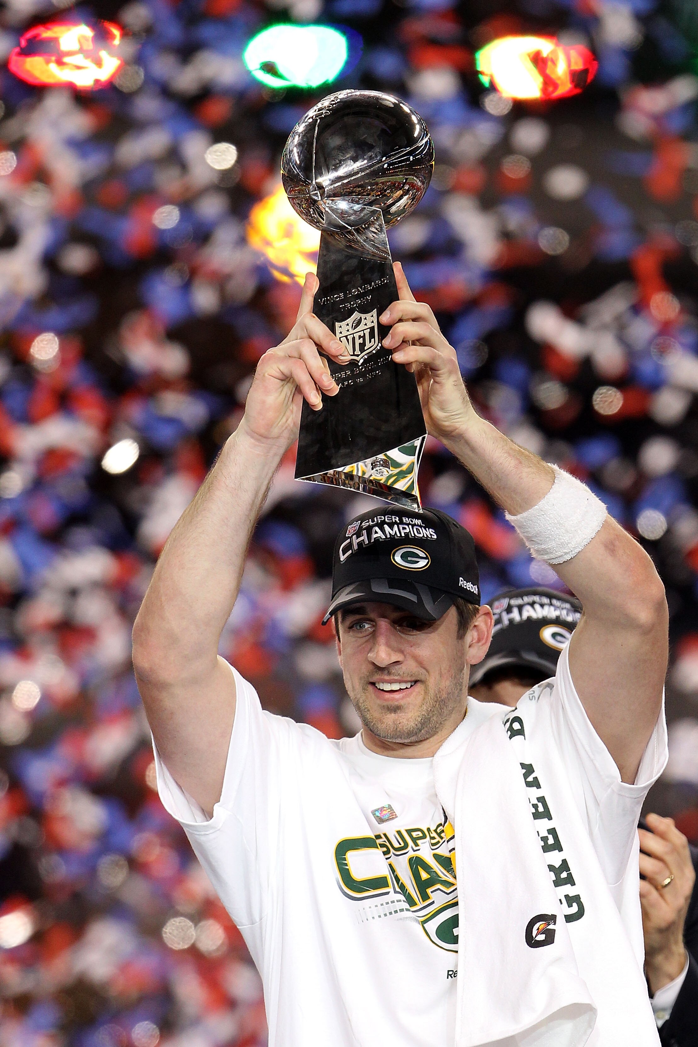 ARLINGTON, TX - FEBRUARY 06:  MVP Aaron Rodgers #12 of the Green Bay Packers holds up The Vince Lombardi Trophy after the Green Bay Packers defeated the Pittsburgh Steelers 31 to 25 in Super Bowl XLV at Cowboys Stadium on February 6, 2011 in Arlington, Te