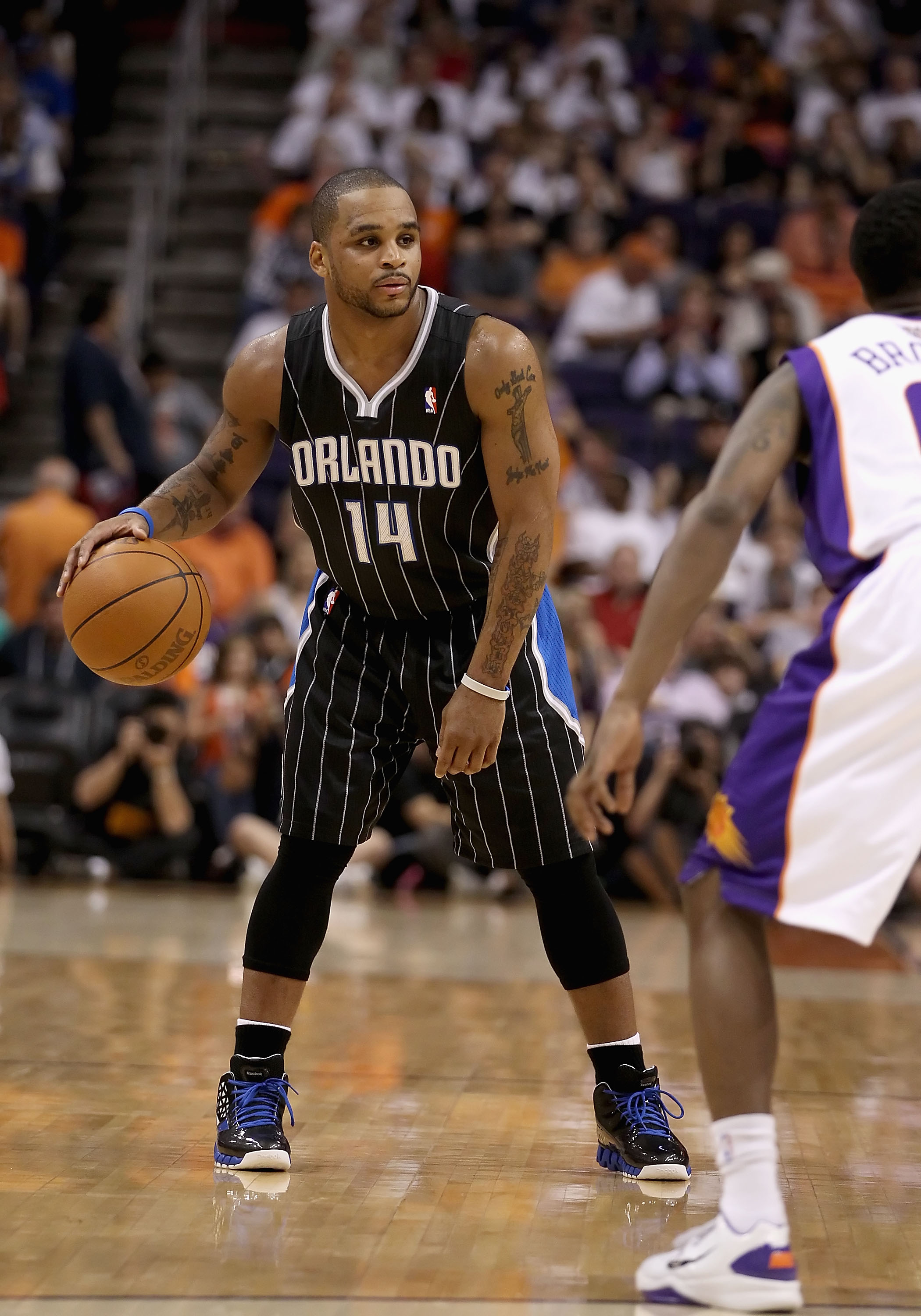 PHOENIX, AZ - MARCH 13: Jameer Nelson #14 of the Orlando Magic handles the ball during the NBA game against the Phoenix Suns at US Airways Center on March 13, 2011 in Phoenix, Arizona. The Magic defeated the Suns 111-88. NOTE TO USER: User expressly ackn PHOENIX, AZ - MARCH 13: Jameer Nelson #14 of the Orlando Magic handles the ball during the NBA game against the Phoenix Suns at US Airways Center on March 13, 2011 in Phoenix, Arizona. The Magic defeated the Suns 111-88. NOTE TO USER: User expressly ackn