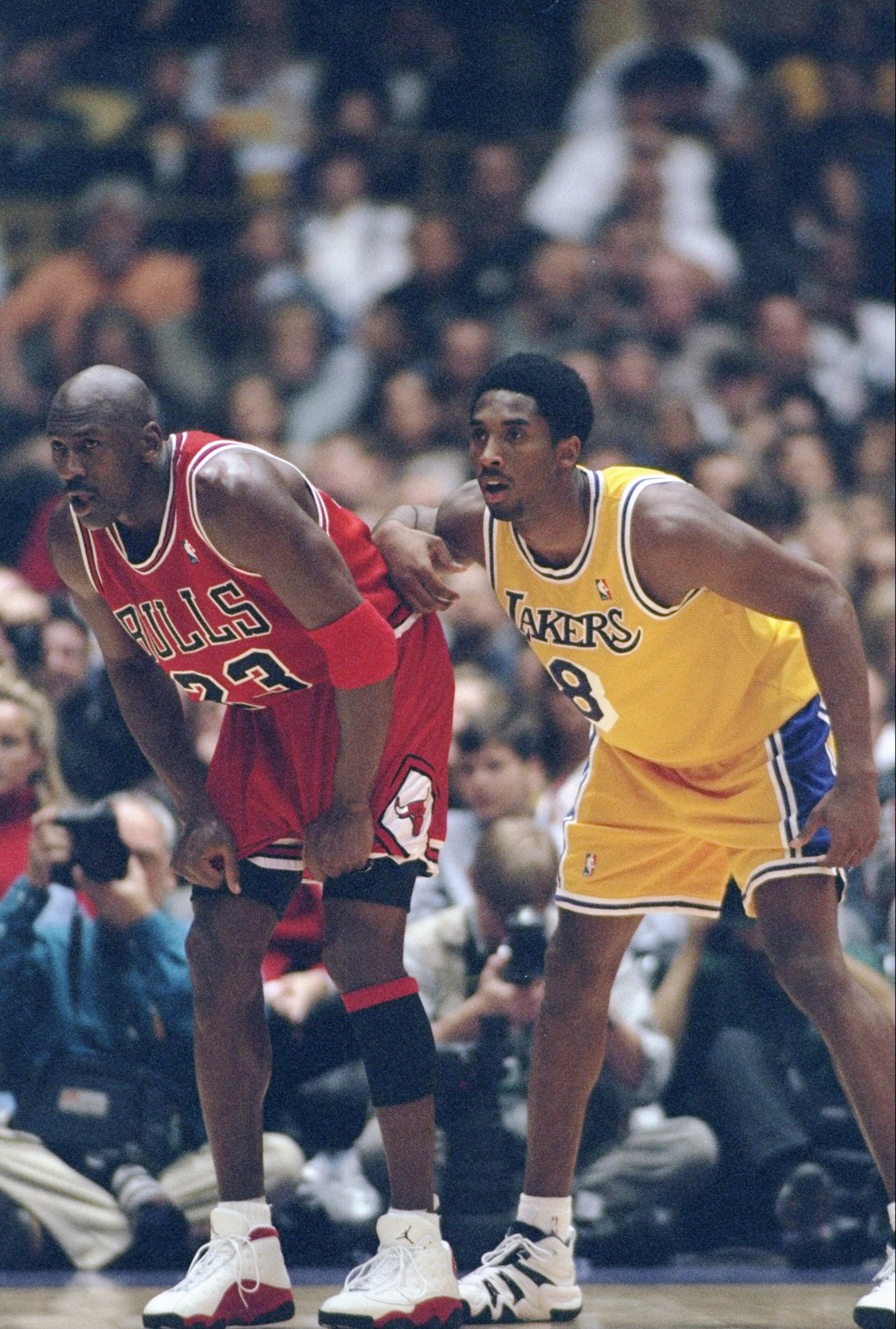 1 Feb 1998:  Guard Michael Jordan of the Chicago Bulls (left) and guard Kobe Bryant of the Los Angeles Lakers look on during a game at the Great Western Forum in Inglewood, California.  The Lakers won the game, 112-87. Mandatory Credit: Jed Jacobsohn  /Al