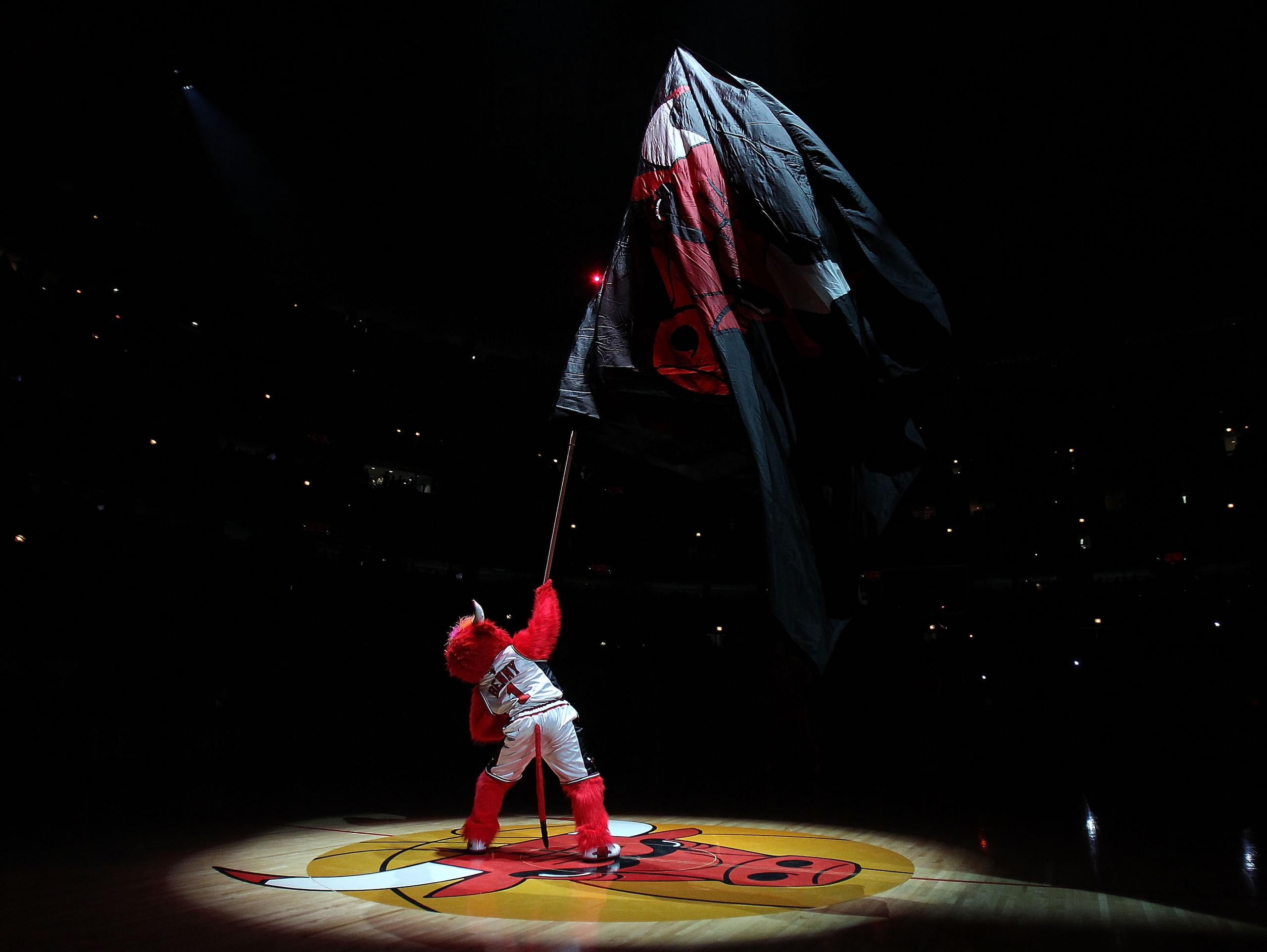CHICAGO, IL - MARCH 07: Benny, the mascot of the Chicago Bulls, waves a flag before a game against the New Orleans Hornets at the United Center on March 7, 2011 in Chicago, Illinois. The Bulls defeated the Hornets 85-77. NOTE TO USER: User expressly ackno