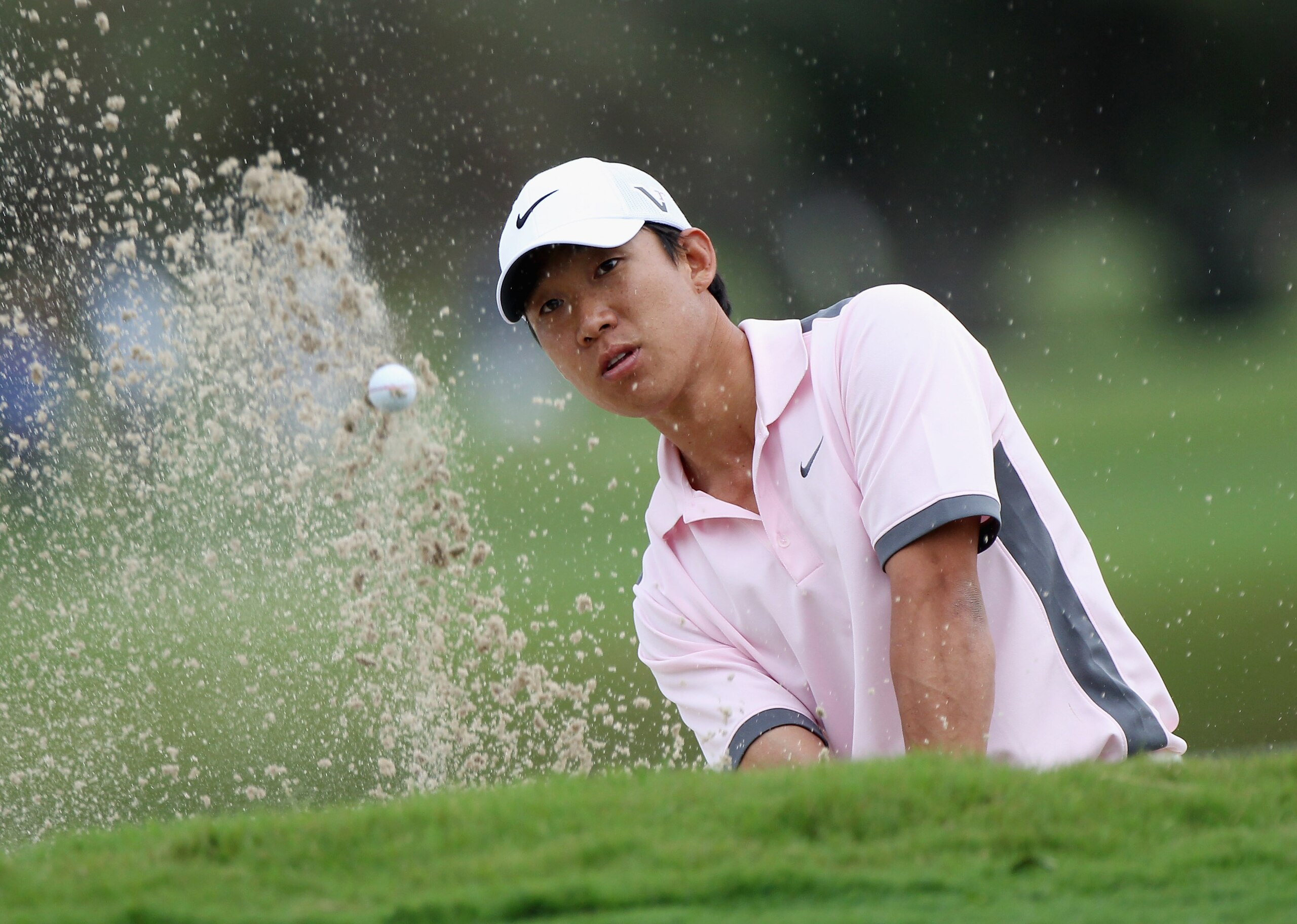 DORAL, FL - MARCH 10:  Anthony Kim hits a bunker shot on the 15h hole during the first round of the 2011 WGC- Cadillac Championship at the TPC Blue Monster at the Doral Golf Resort and Spa on March 10, 2011 in Doral, Florida.  (Photo by Sam Greenwood/Gett