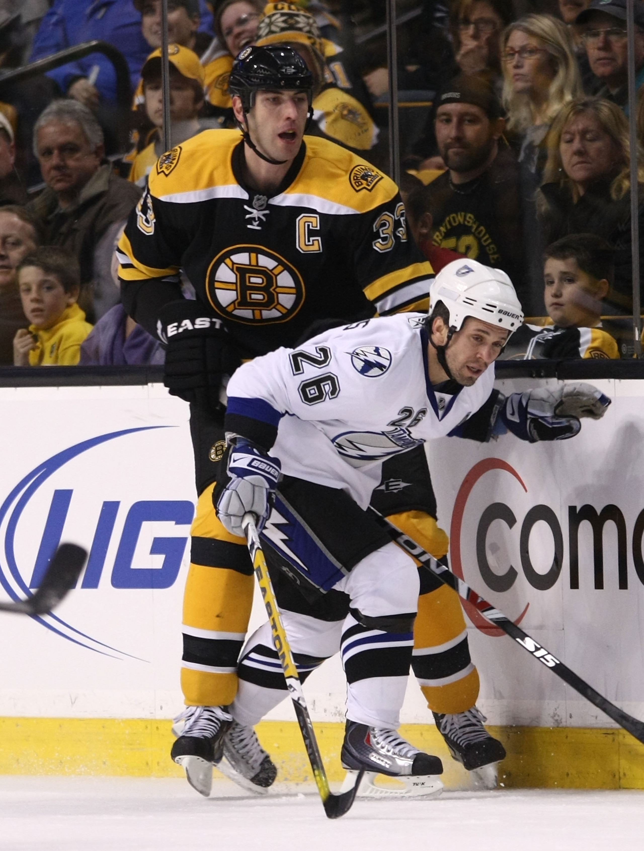 BOSTON - DECEMBER 02:  Zdeno Chara #33 of the Boston Bruins skates against Martin St. Louis #26 of the Tampa Bay Lightning at the TD Garden on December 2, 2009 in Boston, Massachusetts. The Bruins defeated the Lightning 4-1.  (Photo by Bruce Bennett/Getty