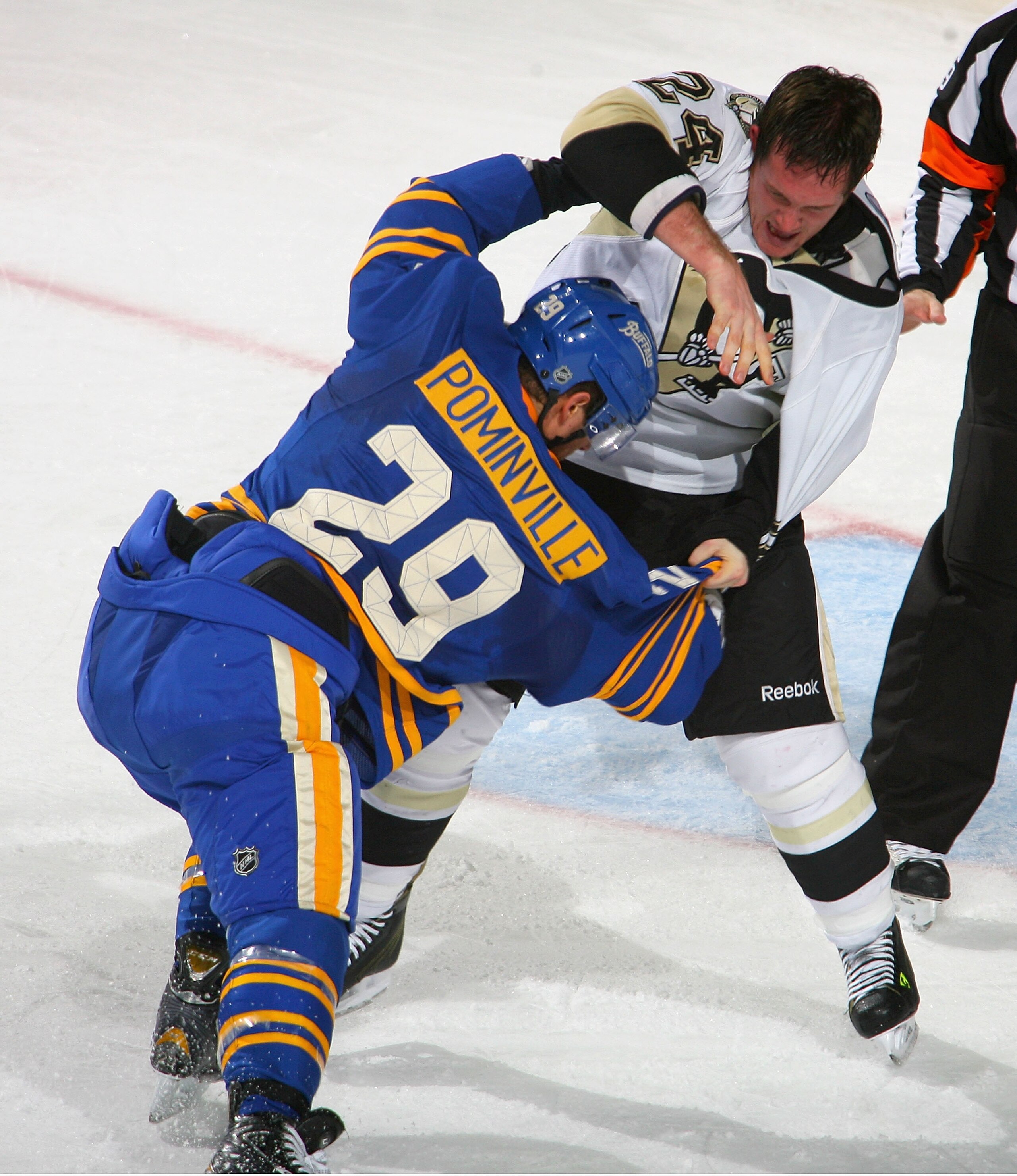 BUFFALO, NY - DECEMBER 11: Jason Pominville #29 of the Buffalo Sabres fights with Matt Cooke #24 of the Pittsburgh Penguins in the first period at HSBC Arena on December 11, 2010 in Buffalo, New York.  (Photo by Rick Stewart/Getty Images)