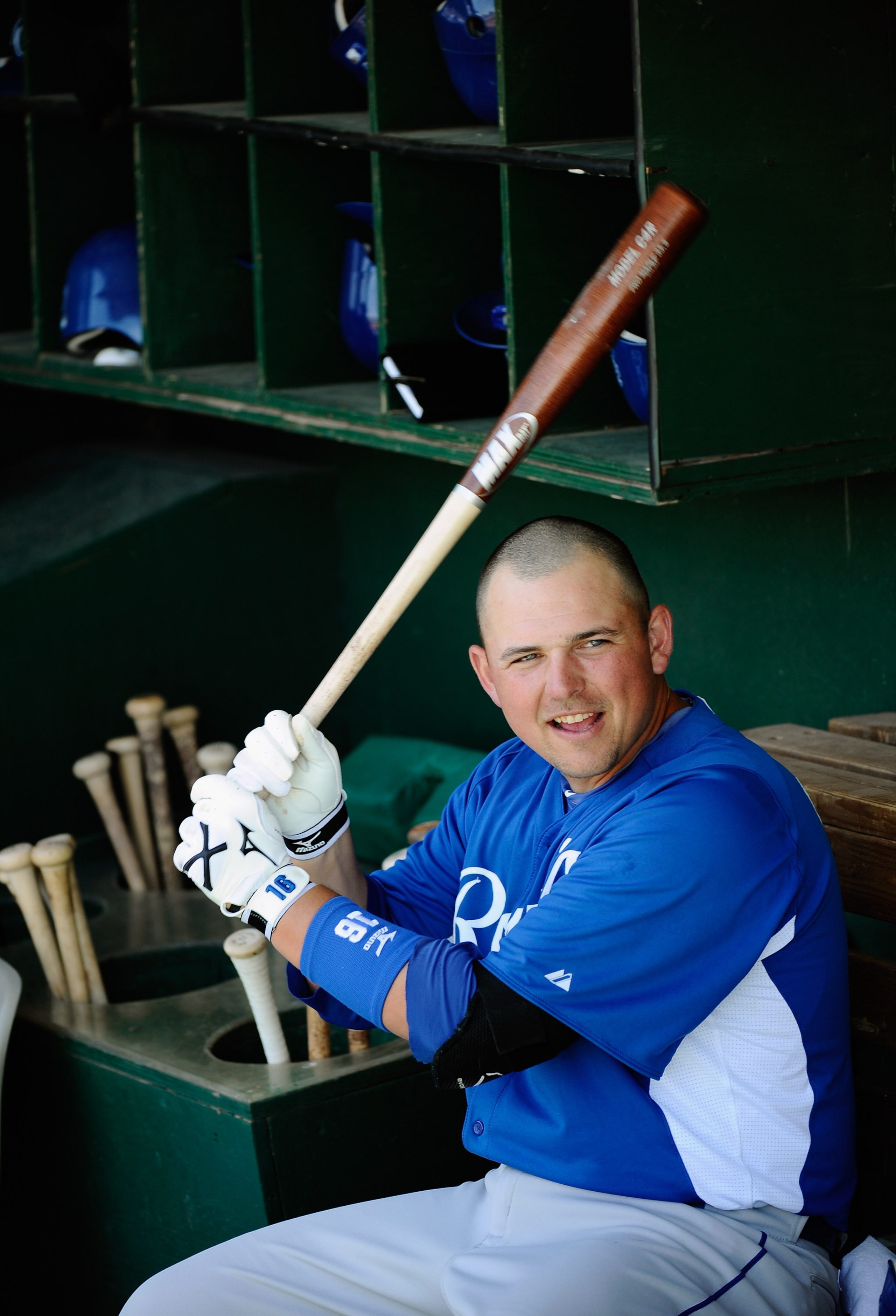 MESA, AZ - MARCH 09:  Billy Butler #16 of the Kansas City Royals swings the bat in the dugout prior to the start of the spring training baseball game against the Chicago Cubs at HoHoKam Stadium on March 9, 2011 in Mesa, Arizona.  (Photo by Kevork Djansezi