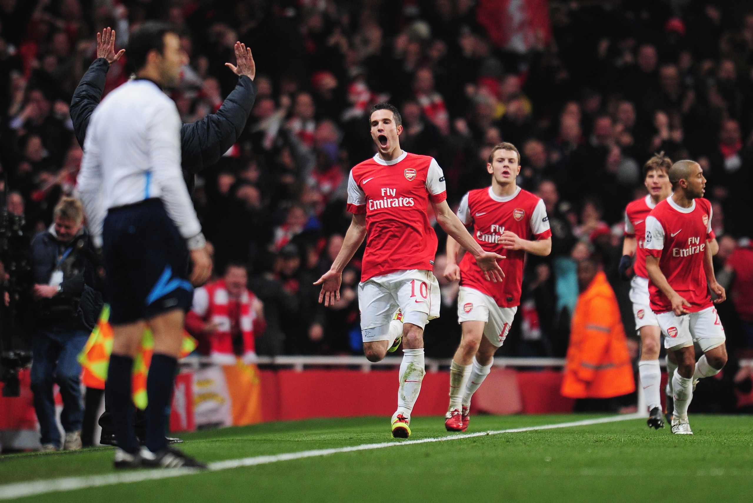 LONDON, ENGLAND - FEBRUARY 16:  Robin van Persie of Arsenal celebrates Arsenal's first goal during the UEFA Champions League round of 16 first leg match between Arsenal and Barcelona at the Emirates Stadium on February 16, 2011 in London, England.  (Photo