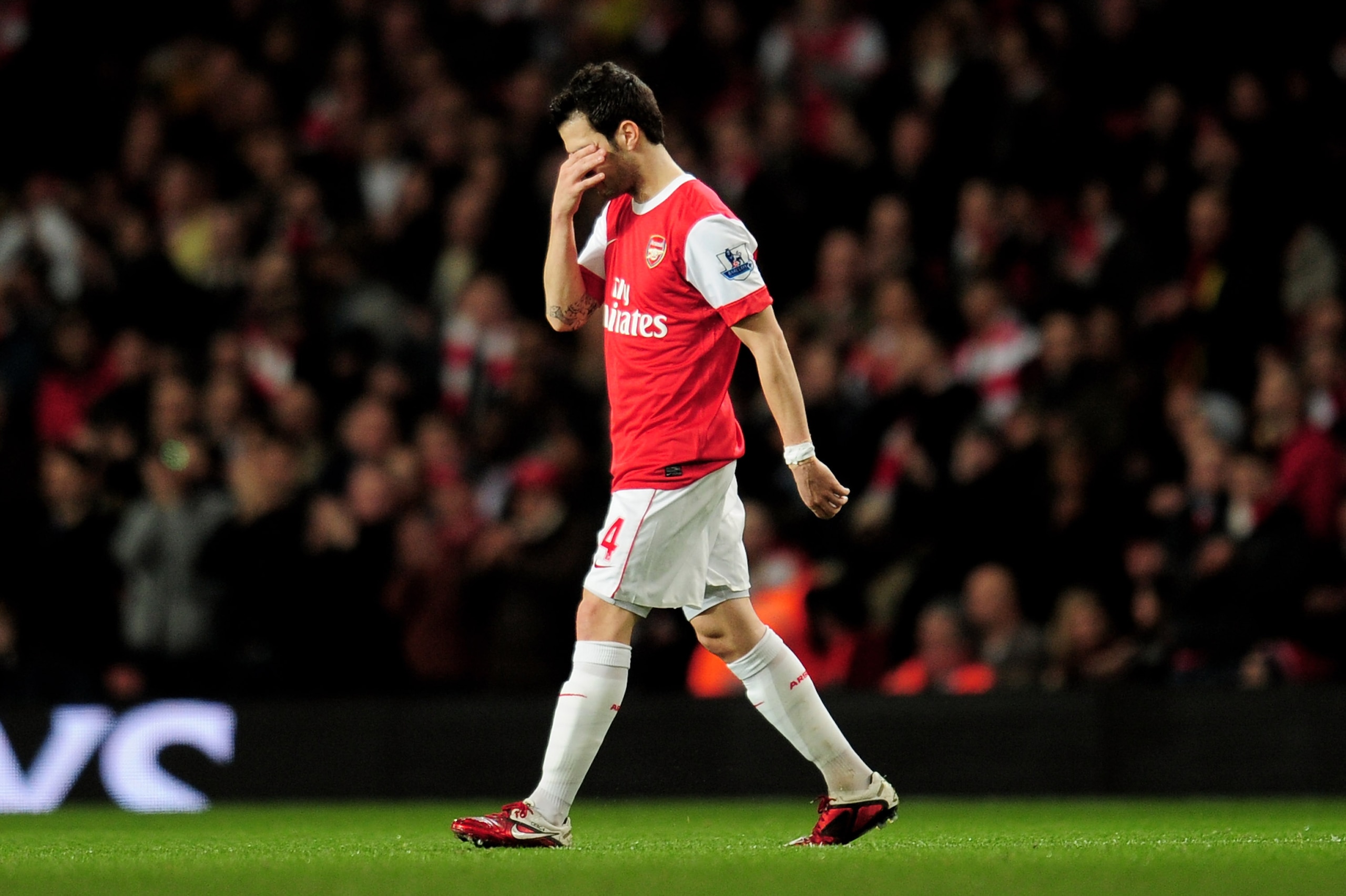 LONDON, ENGLAND - FEBRUARY 23:  Cesc Fabregas of Arsenal  looks dejected as he leaves the pitch injured during the Barclays Premier League match between Arsenal and Stoke City at the Emirates Stadium on February 23, 2011 in London, England.  (Photo by Sha