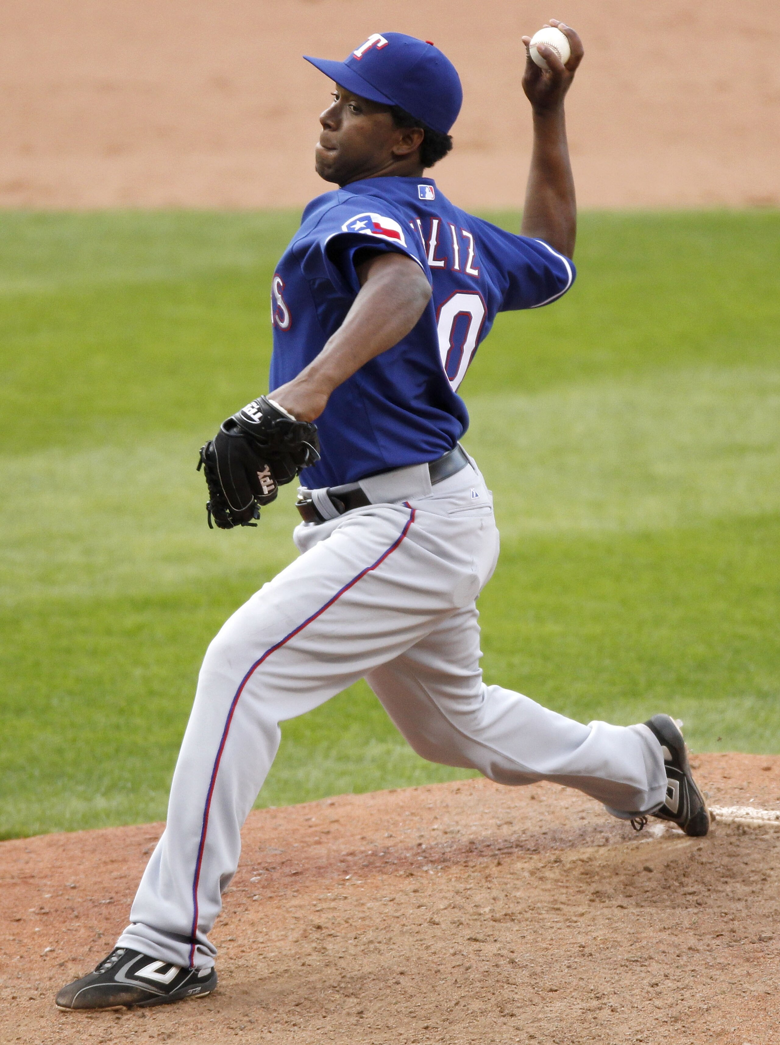 CLEVELAND, OH - APRIL 12:  Neftali Perez #30 of the Texas Rangers throws a pitch in the 10th inning against the Cleveland Indians during Opening Day on April 12, 2010 at Progressive Field in Cleveland, Ohio. Texas won the game 4-2 in 10 innings.  (Photo b