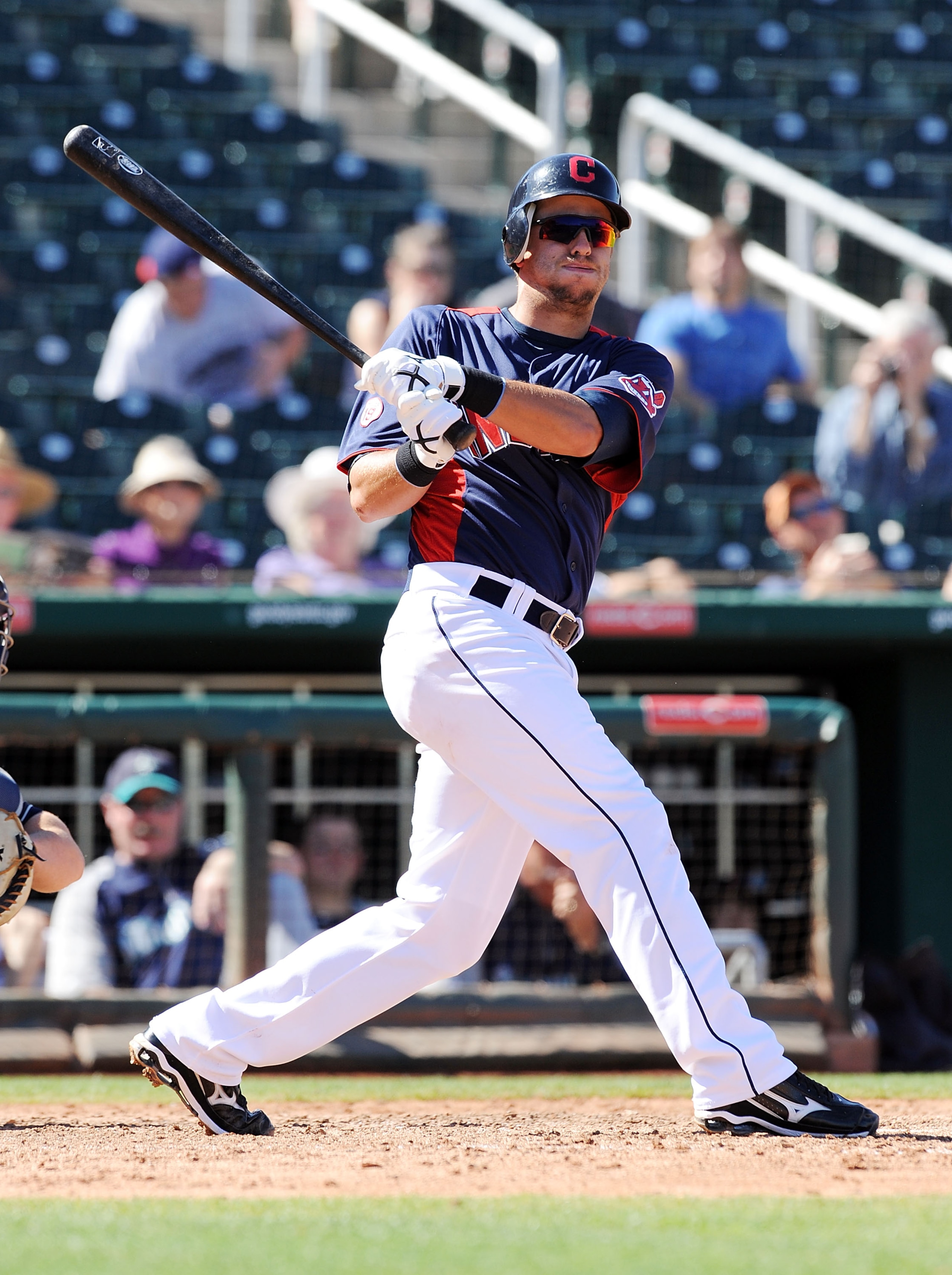 GOODYEAR, AZ - MARCH 11:  Lonnie Chisenhall #76 of the Cleveland Indians follows through on a swing against the Seattle Mariners at Goodyear Ballpark on March 11, 2011 in Goodyear, Arizona.  (Photo by Norm Hall/Getty Images)