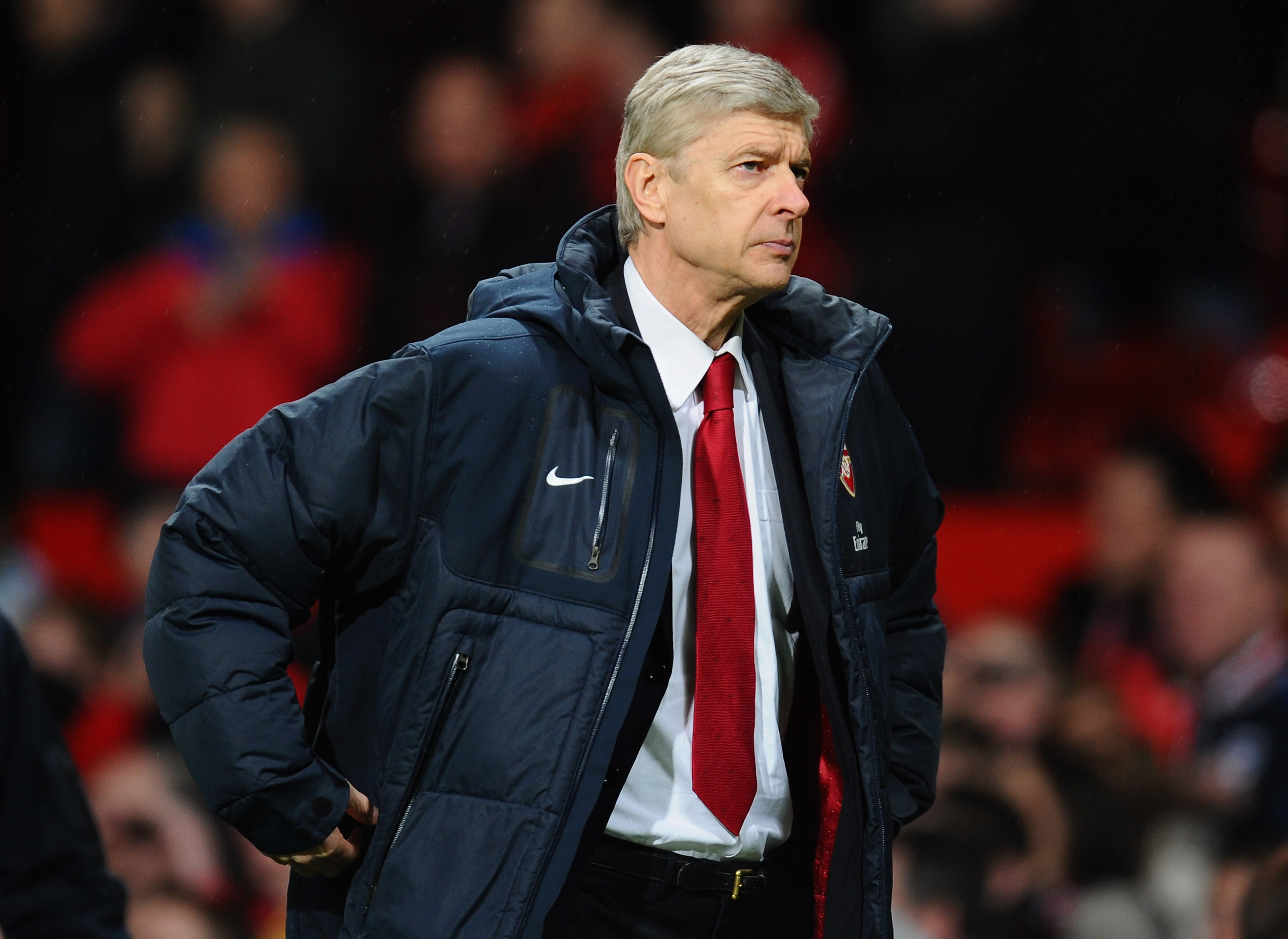 MANCHESTER, ENGLAND - MARCH 12:  Arsenal manager Arsene Wenger looks dejected after defeat in the FA Cup sponsored by E.On Sixth Round match between Manchester United and Arsenal at Old Trafford on March 12, 2011 in Manchester, England.  (Photo by Clive M