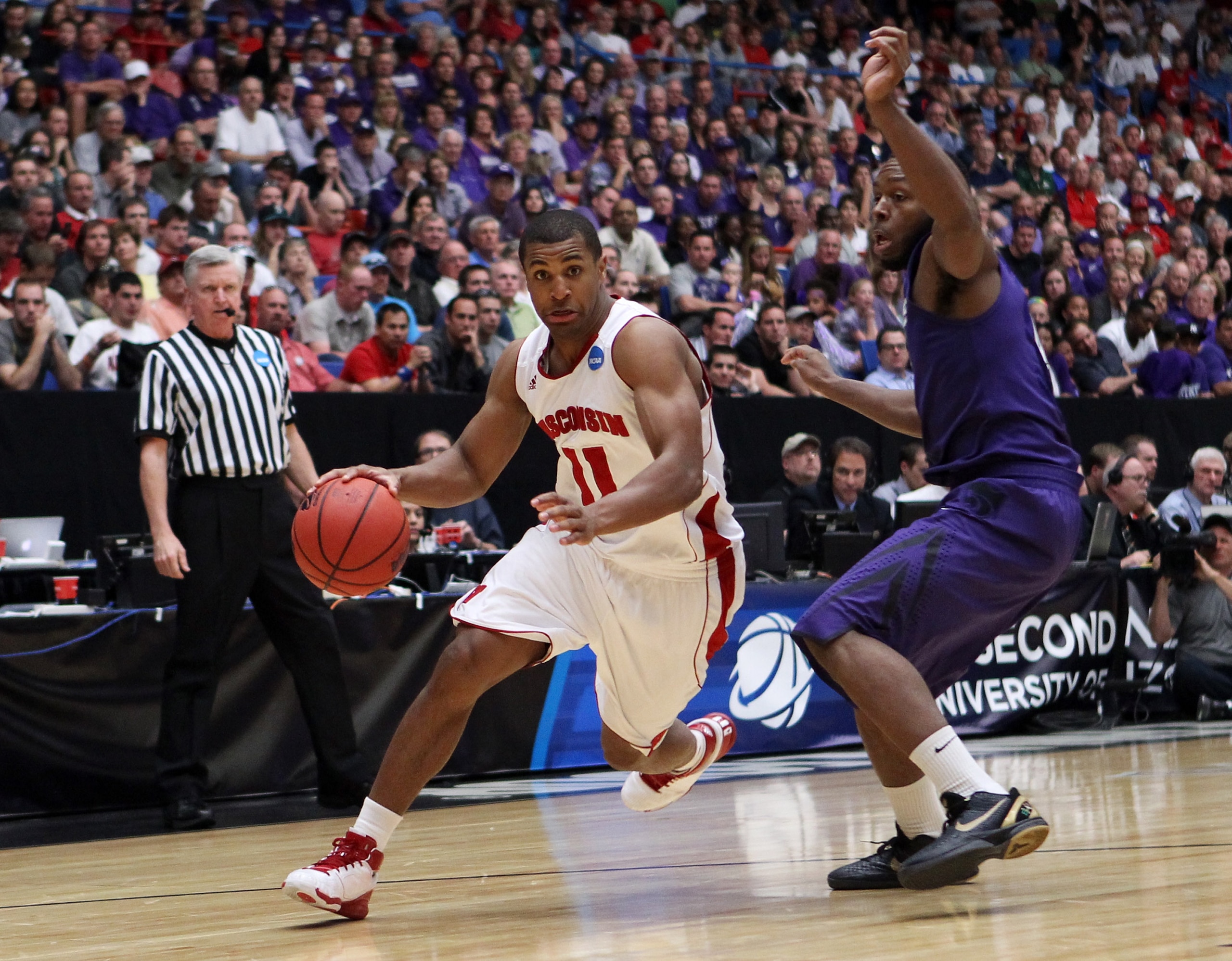 TUCSON, AZ - MARCH 19: Jordan Taylor #11 of the Wisconsin Badgers drives against Jacob Pullen #0 of the Kansas State Wildcats during the third round of the 2011 NCAA men's basketball tournament at McKale Center on March 19, 2011 in Tucson, Arizona. (Pho TUCSON, AZ - MARCH 19: Jordan Taylor #11 of the Wisconsin Badgers drives against Jacob Pullen #0 of the Kansas State Wildcats during the third round of the 2011 NCAA men's basketball tournament at McKale Center on March 19, 2011 in Tucson, Arizona. (Pho
