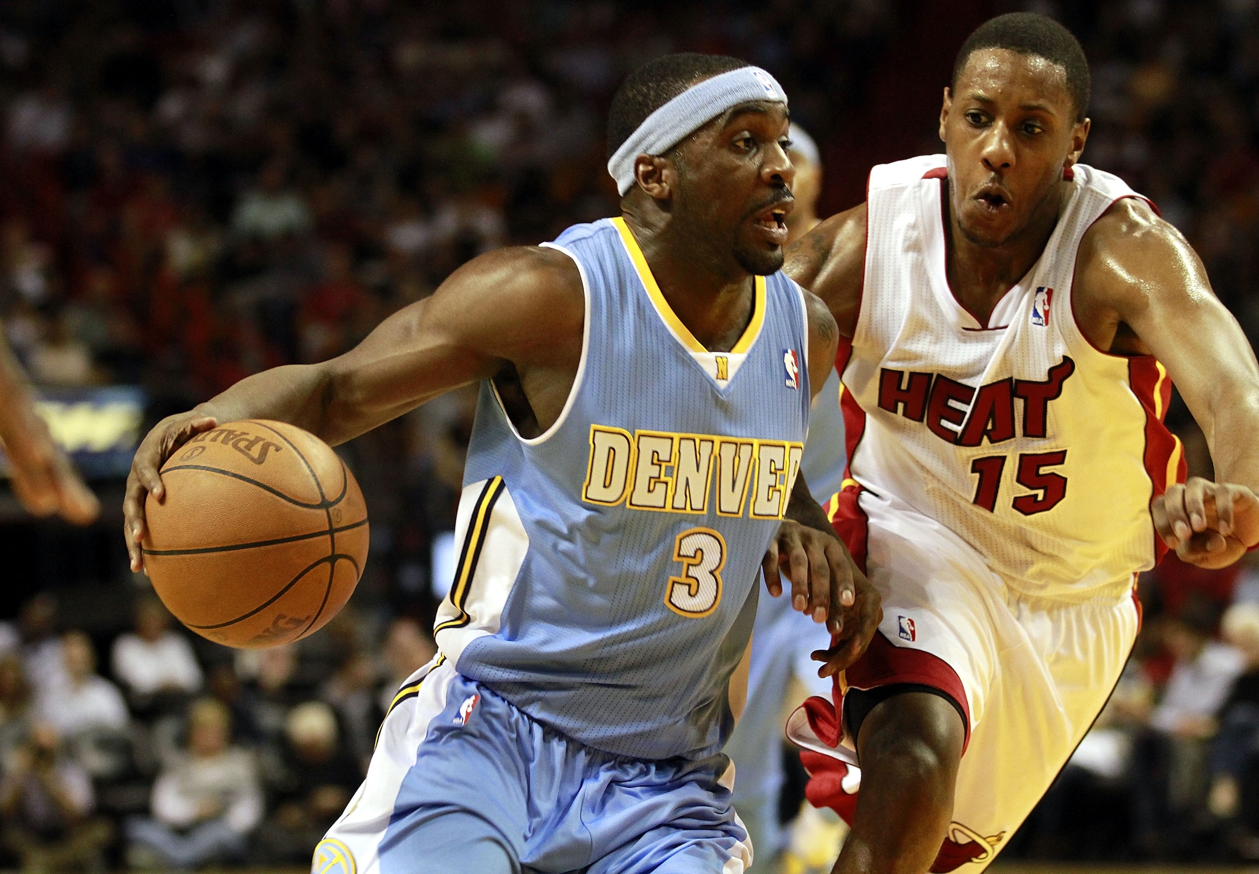 MIAMI, FL - MARCH 19:  Guard Mario Chambers #15  of the Miami Heat defends against guard Ty Lawson #3 of the Denver Nuggets at American Airlines Arena on March 19, 2011 in Miami, Florida.  The Heat defeated the Nuggets 103-98. NOTE TO USER: User expressly