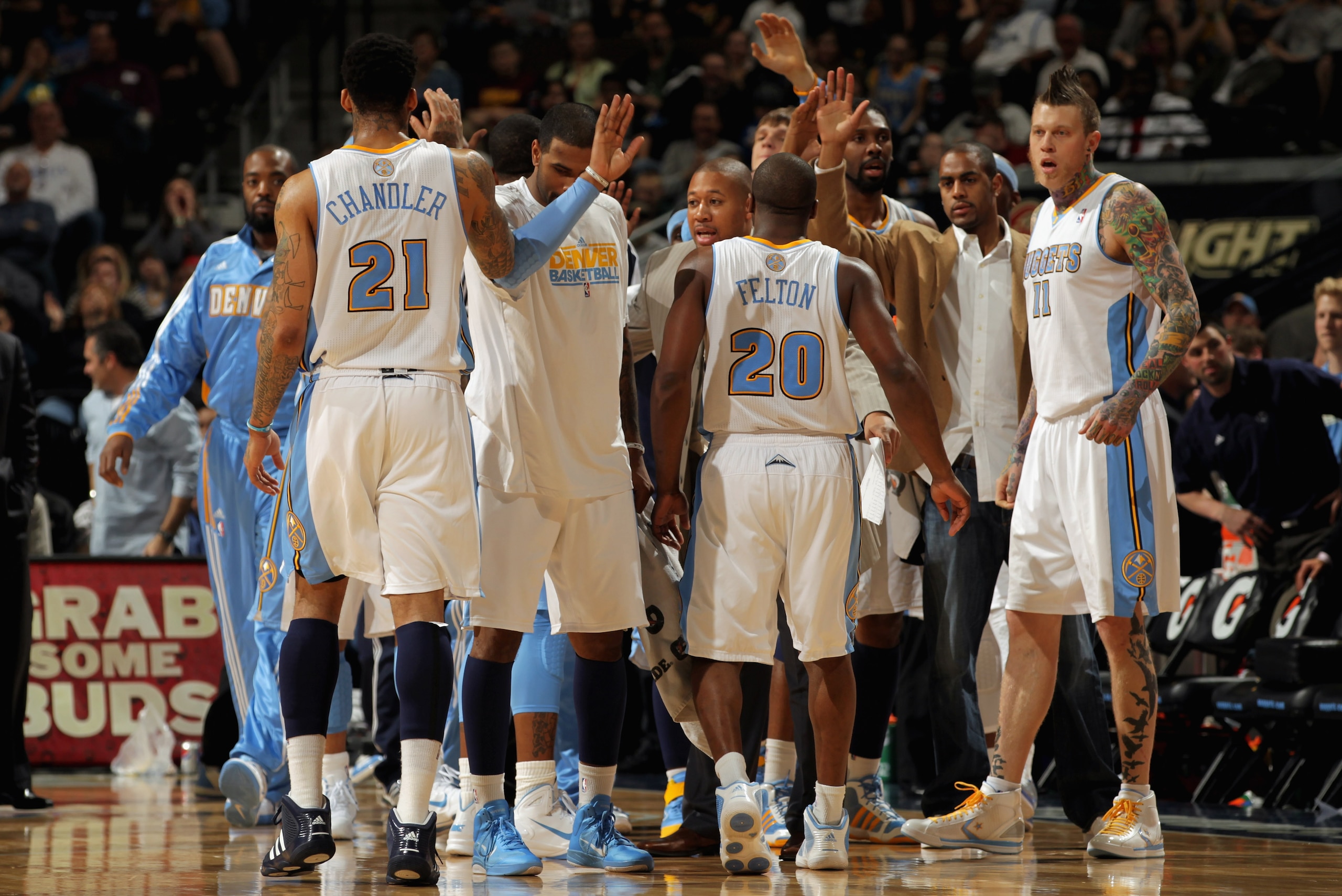 DENVER, CO - MARCH 12:  The Denver Nuggets celebrate as they head to the bench for a time out against the Detroit Pistons at the Pepsi Center on March 12, 2011 in Denver, Colorado. The Nuggets defeated the Pistons 131-101.  NOTE TO USER: User expressly ac