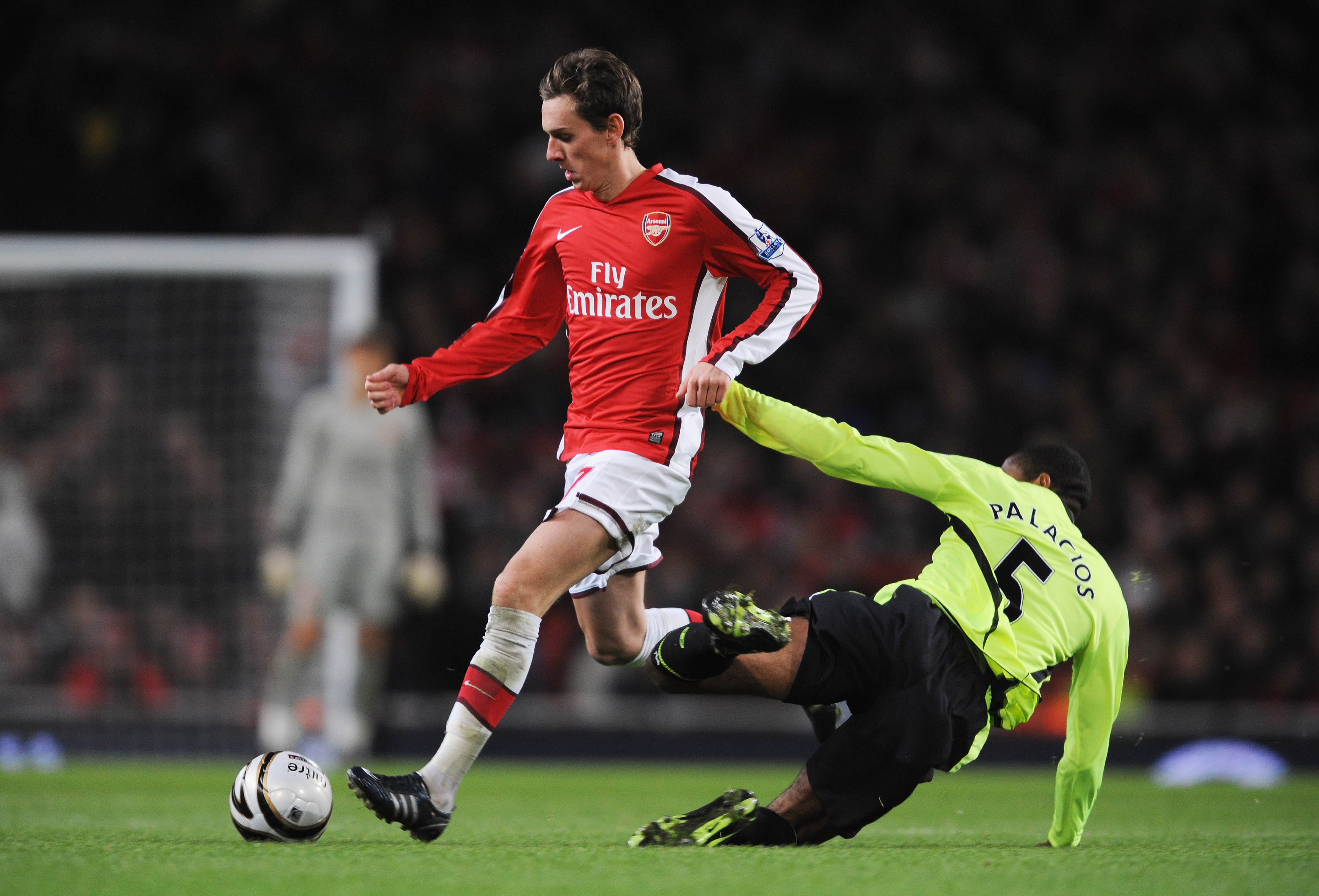 LONDON - NOVEMBER 11:  Mark Randall (L) of Arsenal is tackled by Wilson Palacios of Wigan during the Carling Cup fourth round match between Arsenal and Wigan Athletic at the Emirates Stadium on November 11, 2008 in London, England.  (Photo by Shaun Botter