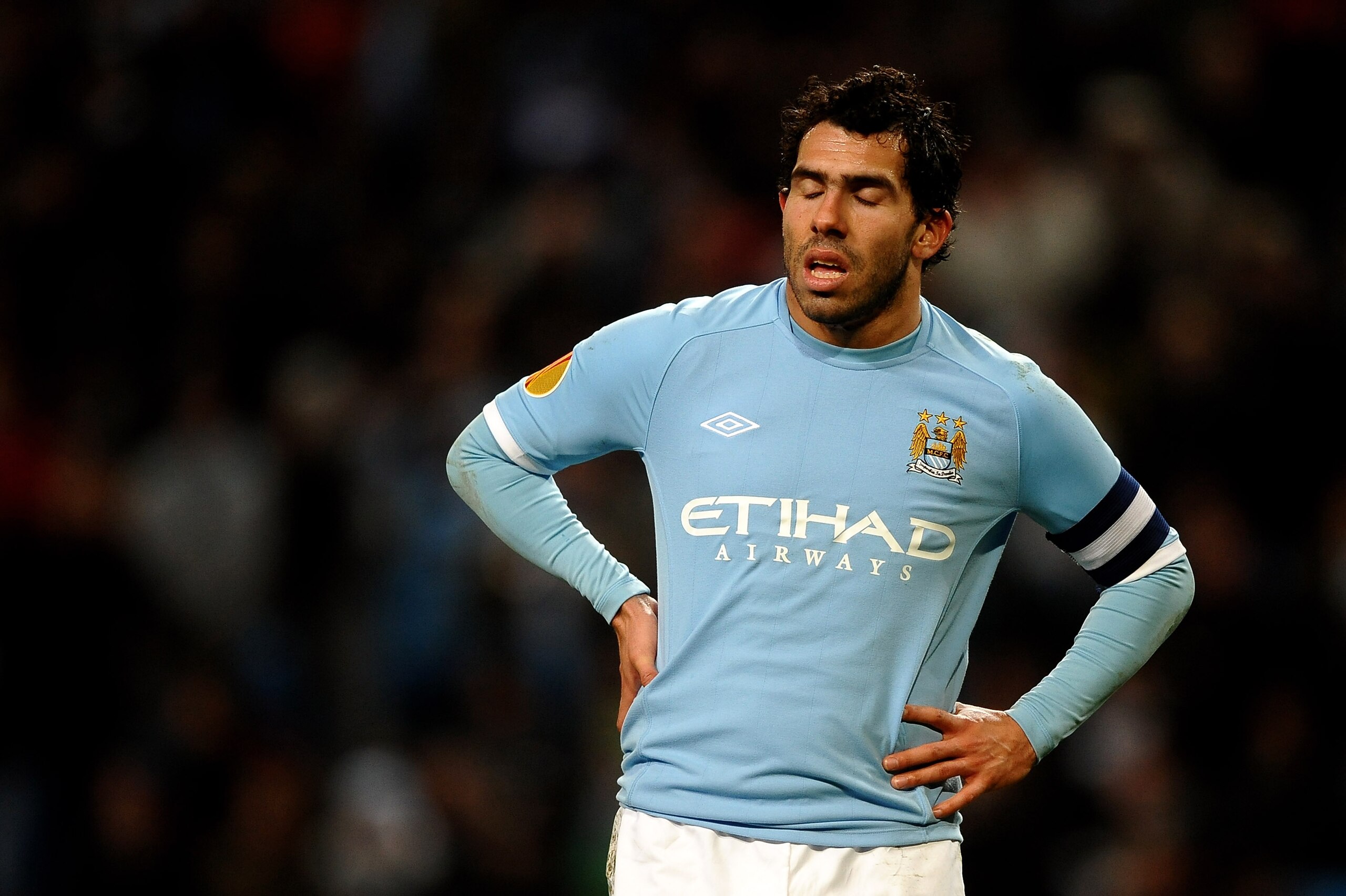 MANCHESTER, ENGLAND - MARCH 17:  Carlos Tevez of Manchester City shuts his eyes during the UEFA Europa League round of 16 second leg match between Manchester City and Dynamo Kiev at City of Manchester Stadium on March 17, 2011 in Manchester, England.  (Ph