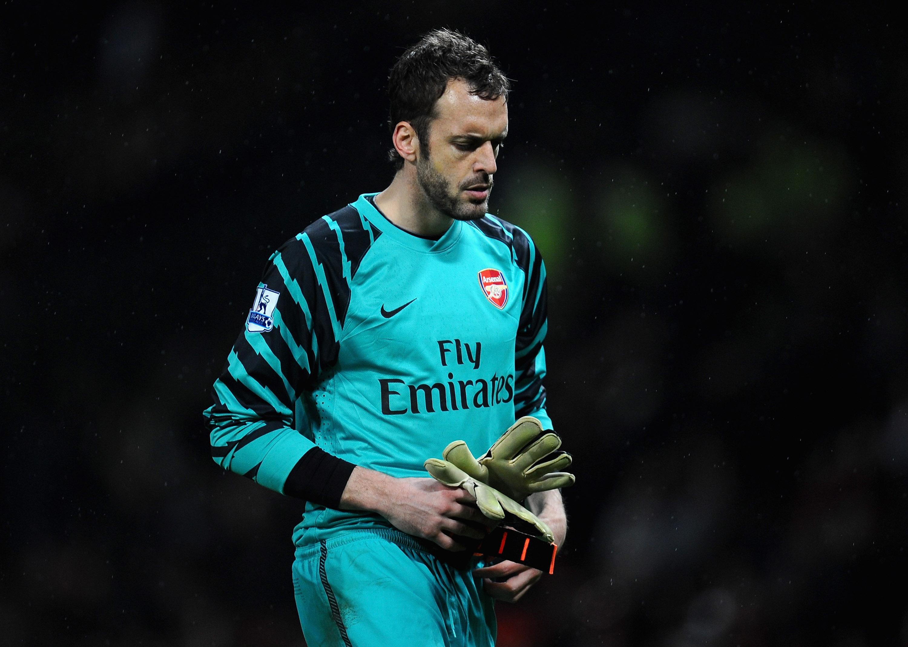 MANCHESTER, ENGLAND - MARCH 12:  Manuel Almunia of Arsenal looks dejected after defeat in the FA Cup sponsored by E.On Sixth Round match between Manchester United and Arsenal at Old Trafford on March 12, 2011 in Manchester, England.  (Photo by Clive Mason