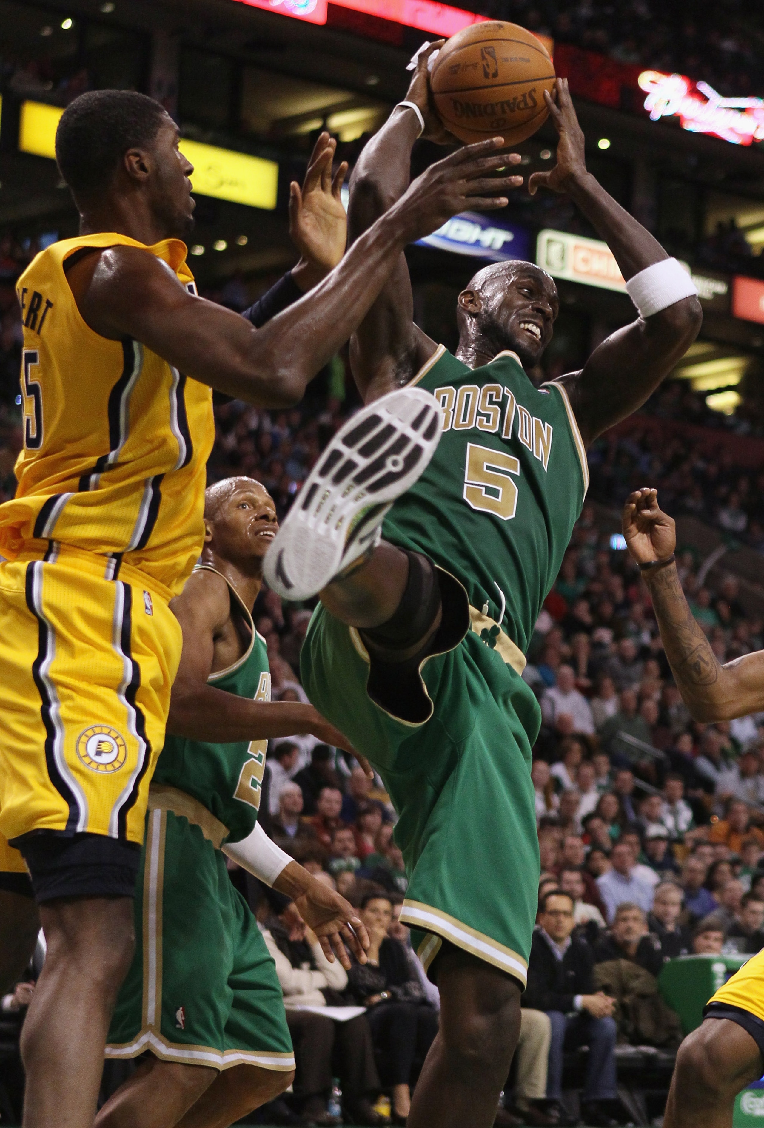 BOSTON, MA - MARCH 16:  Kevin Garnett #5 of the Boston Celtics and Roy Hibbert #55 of the Indiana Pacers fight for the rebound on March 16, 2011 at the TD Garden in Boston, Massachusetts. The Celtics defeated the Indiana Pacers 92-80. NOTE TO USER: User e